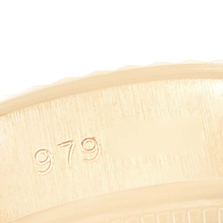 The image shows a close-up of the engraved side of a Rolex President 69178 Women's Yellow Gold Champagne Dial 69178 Women's Yellow Gold Champagne Dial model watch.