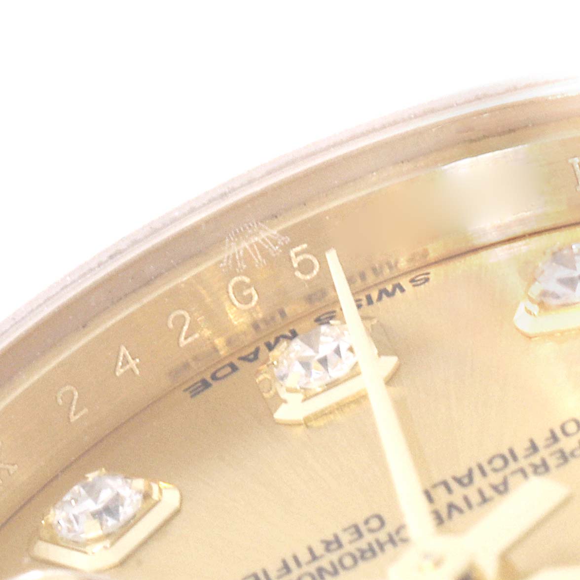 This image shows a close-up of the dial, diamond markers, and bezel of a Rolex President 179158 Women's Yellow Gold Champagne Dial 179158 Women's Yellow Gold Champagne Dial watch.