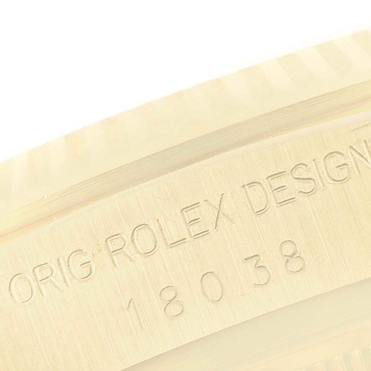 This close-up image shows the side engraving with model number on a Rolex President 18038 Men
s Yellow Gold White Dial 18038 Men
s Yellow Gold White Dial watch.