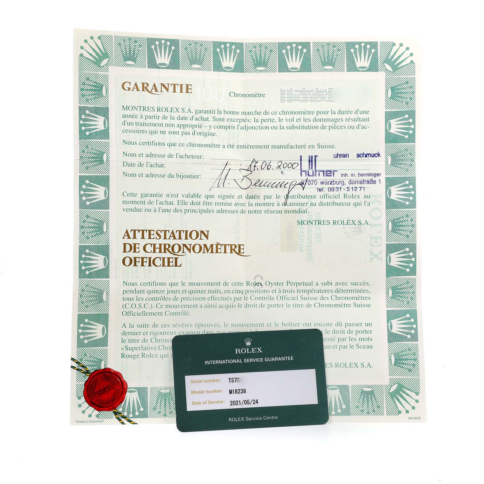 The image shows a guarantee certificate and an international service guarantee card for a Rolex President 18238 Men
s Yellow Gold White Dial 18238 Men
s Yellow Gold White Dial model M18238.