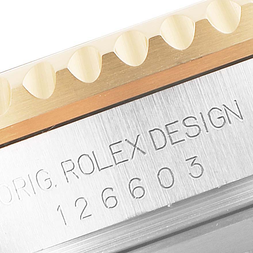 This image shows a close-up of the engraved design and model number on the side of a Rolex Sea-Dweller 126603 Men
s Steel and Gold (two tone) Black Dial 126603 Men
s Steel and Gold (two tone) Black Dial watch.