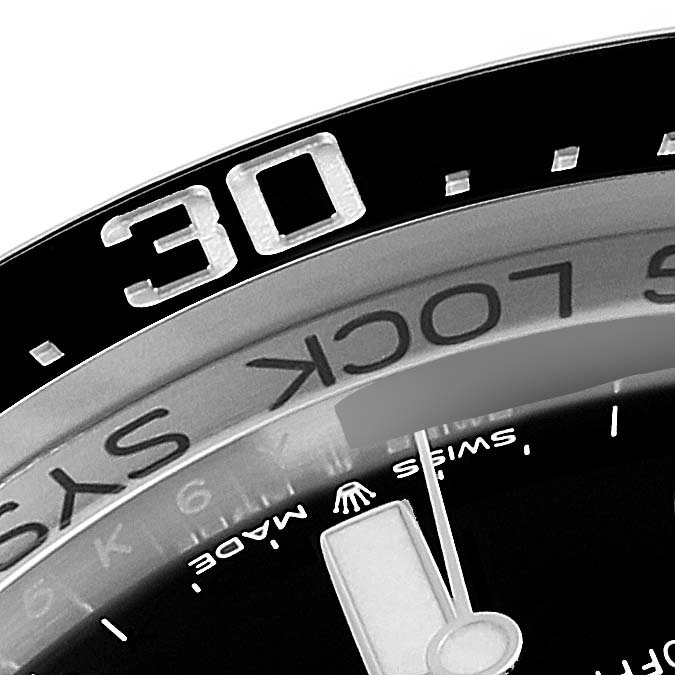 Close-up of the Rolex Sea-Dweller 126660 Men
s Stainless Steel Blue Dial 126660 Men
s Stainless Steel Blue Dial showing the bezel with the 30-minute marker and part of the dial.