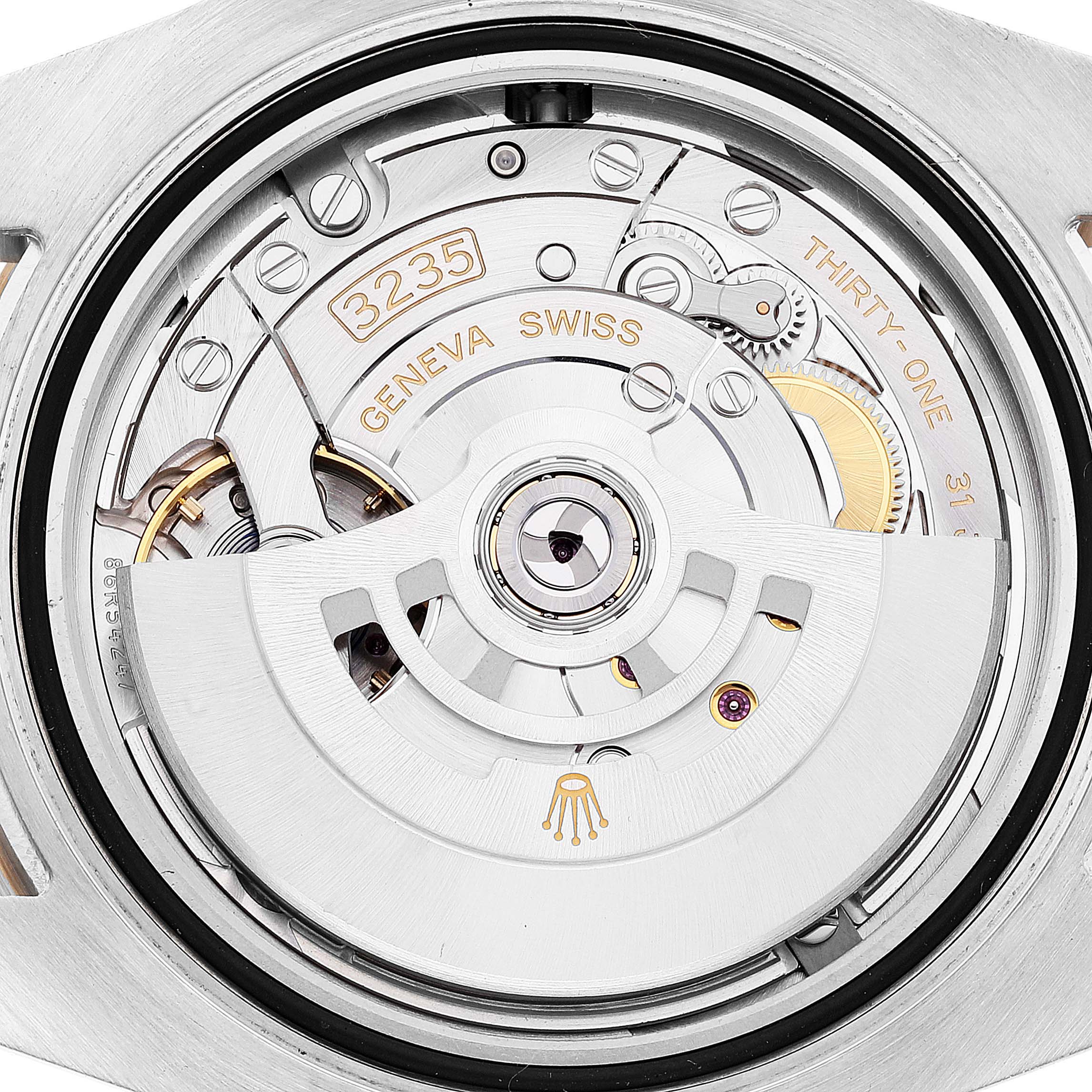 This image shows the back view of the Rolex Submariner 126613 Men's Steel and Gold (two tone) Blue Dial 126613 Men's Steel and Gold (two tone) Blue Dial watch, highlighting its intricate movement mechanism.