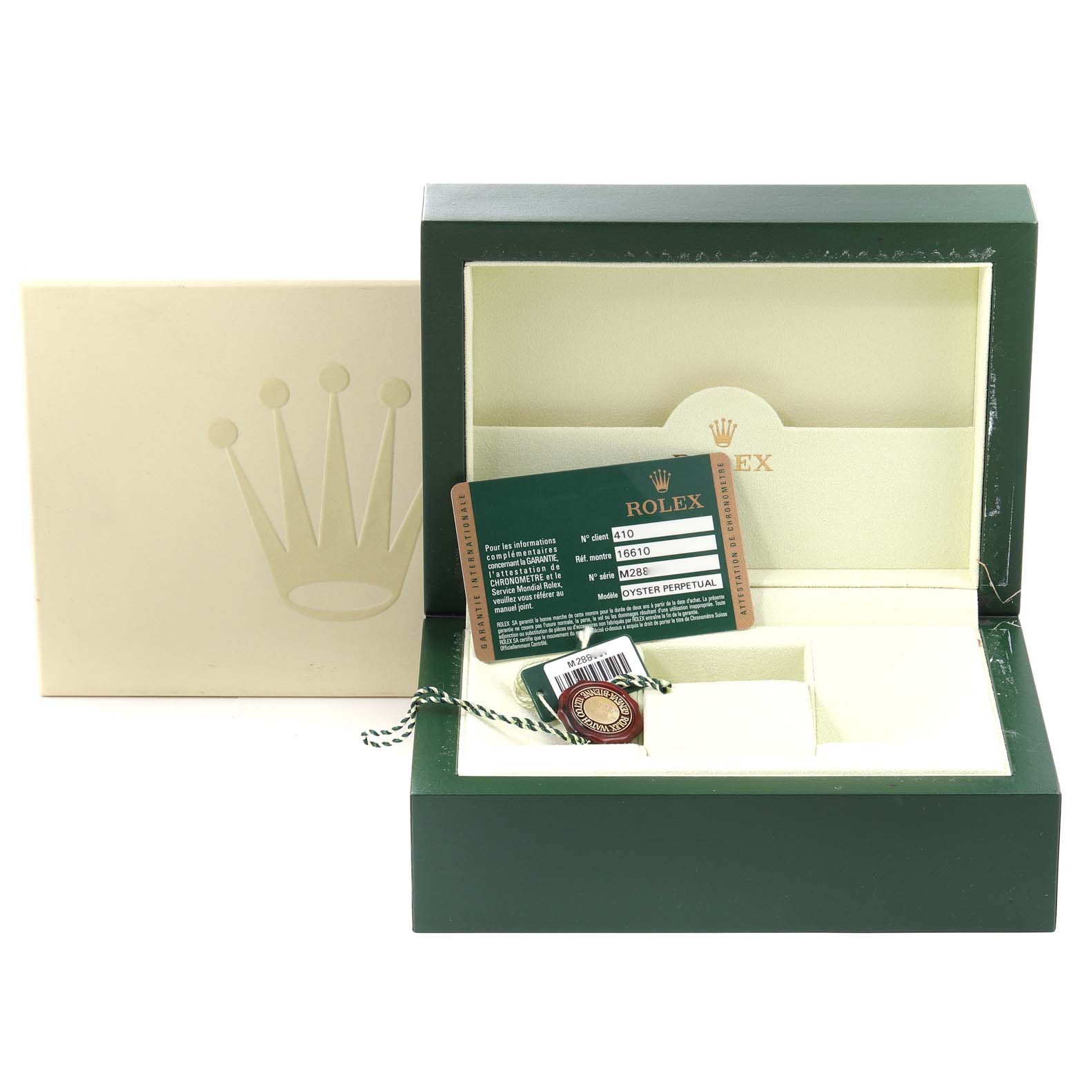 The image shows an open green Rolex watch box for the Submariner model along with warranty cards and tags.