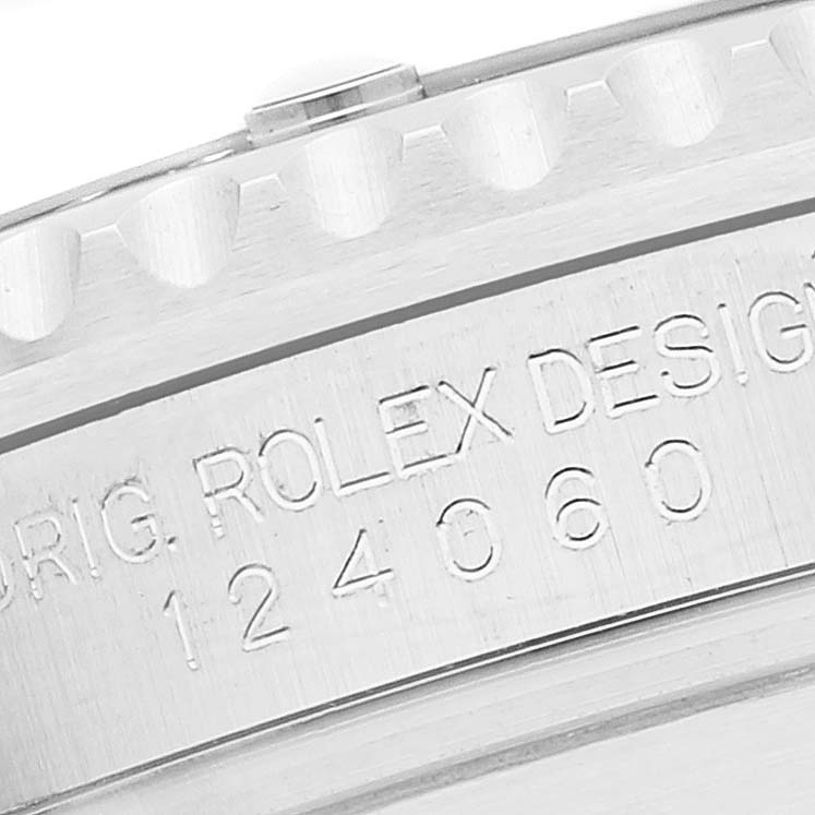 The image shows a close-up view of the side engraving on a Rolex Submariner 124060 Men
s Stainless Steel Black Dial 124060 Men
s Stainless Steel Black Dial watch, highlighting its model number and part of the bezel.