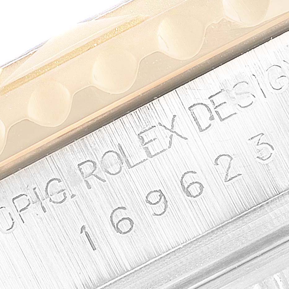 This image shows a close-up of the serial number area of the Rolex Yacht-Master 169623 Women's Steel and Gold (two tone) Grey Dial 169623 Women's Steel and Gold (two tone) Grey Dial watch.