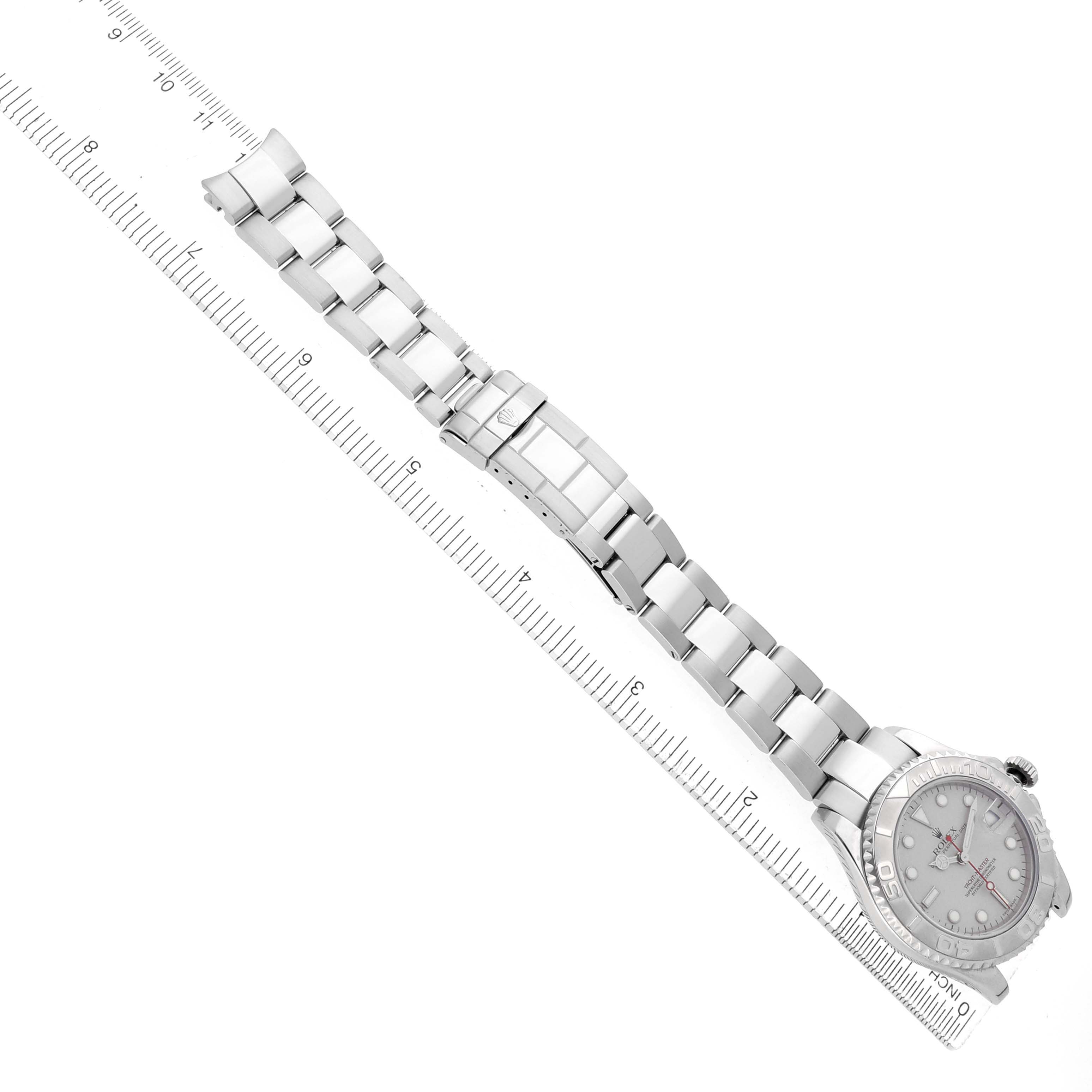 The image shows the Rolex Yacht-Master 168622 Men's Stainless Steel Silver Dial watch laid flat with its full bracelet and clasp visible, measured next to a ruler.