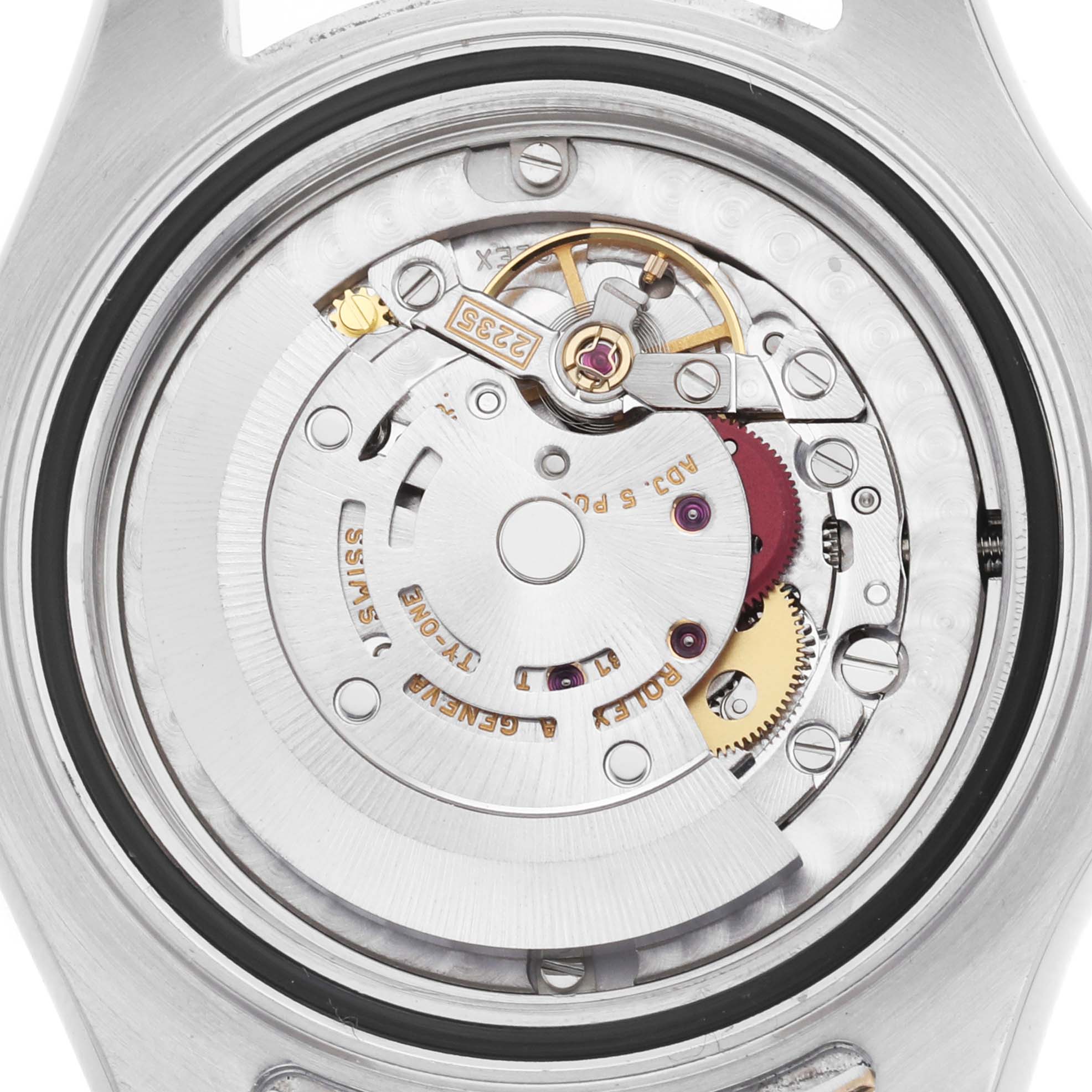 The image shows the movement of a Rolex Yacht-Master 168623 Men's Steel and Gold (two tone) Champagne Dial watch from a rear view, highlighting its intricate mechanical parts.