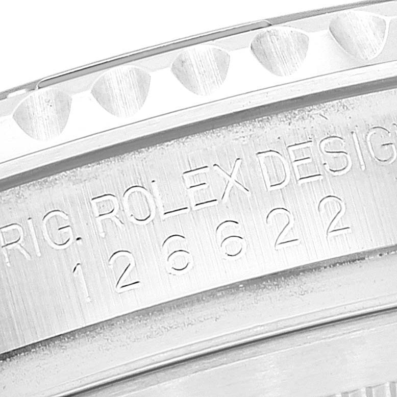 The image shows a close-up of the engraved inner bezel of a Rolex Yacht-Master 126622 Men's Stainless Steel Blue Dial 126622 Men's Stainless Steel Blue Dial watch, including text and design details.