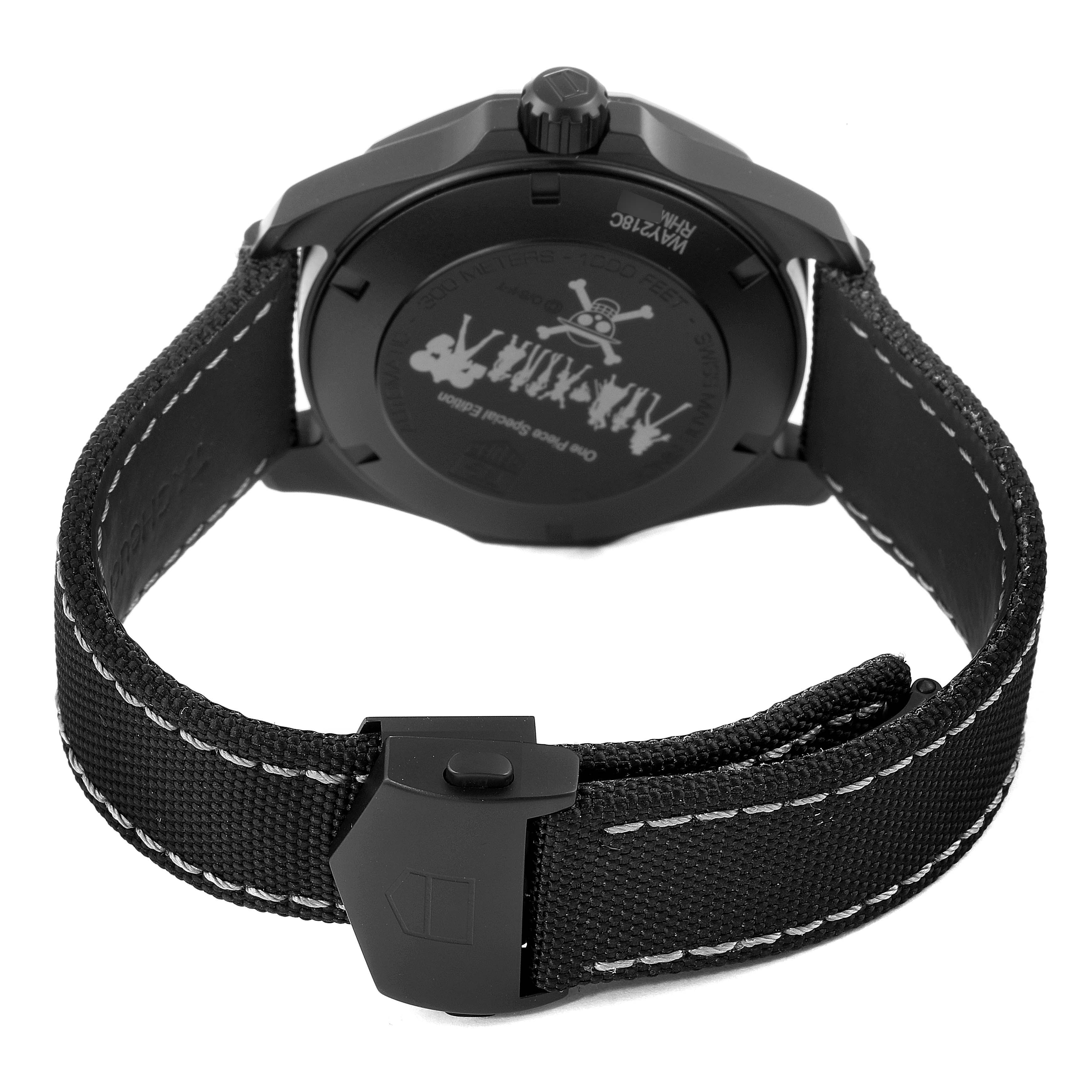 The image shows the back view of a Tag Heuer Aquaracer WAY218C.FC6364 Men's Titanium Grey Dial WAY218C.FC6364 Men's Titanium Grey Dial watch, highlighting the case back and the fabric strap with a clasp.