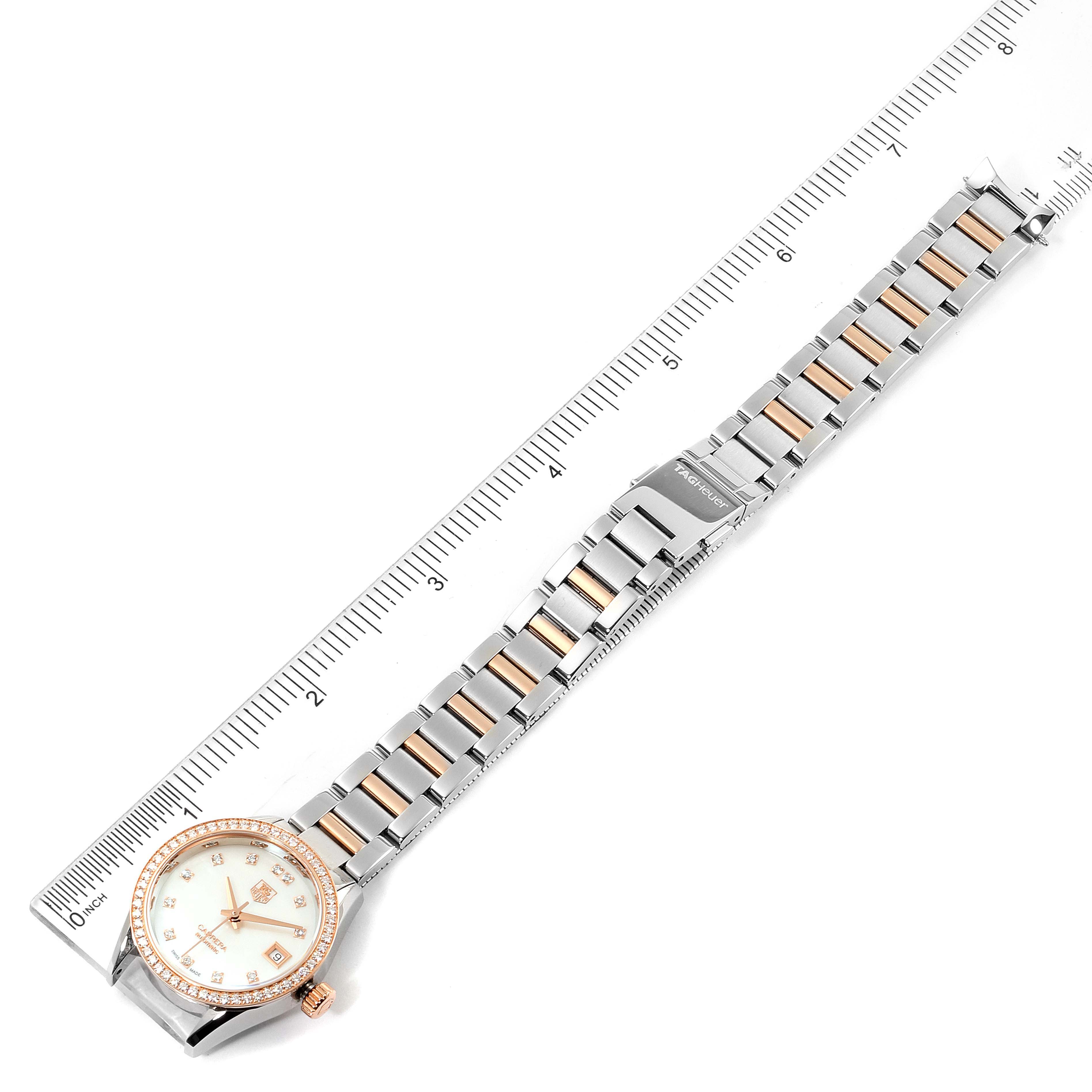 The image shows a full-length Tag Heuer Carrera WAR2453.BD0777 Women's Steel and Gold (two tone) Mother of Pearl Dial WAR2453.BD0777 Women's Steel and Gold (two tone) Mother of Pearl Dial watch, including the face, band, and clasp, measured against a ruler.
