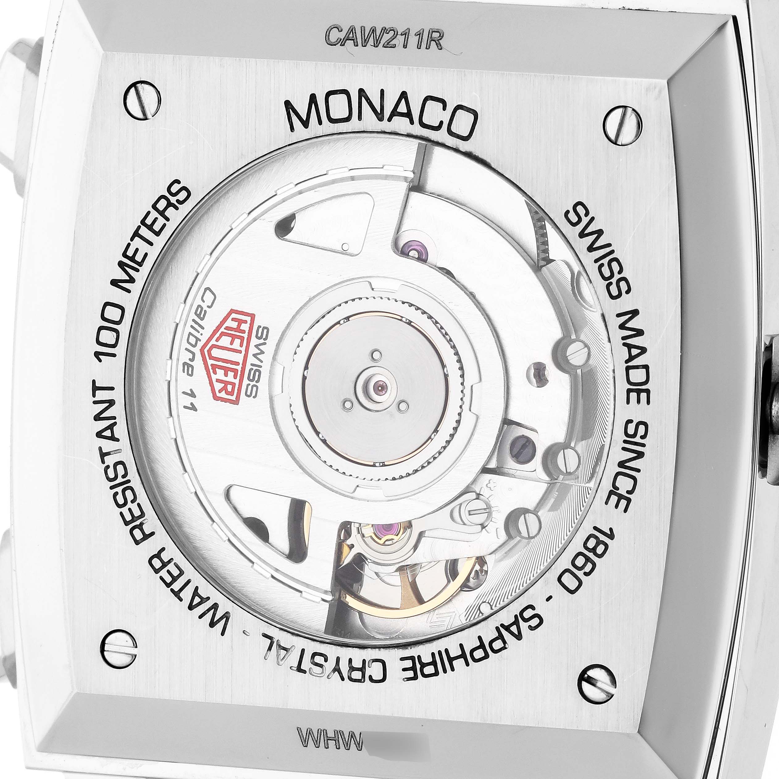 The image shows the back of the Tag Heuer Monaco CAW211R Men's Stainless Steel Blue Dial watch, highlighting its movement and case details.