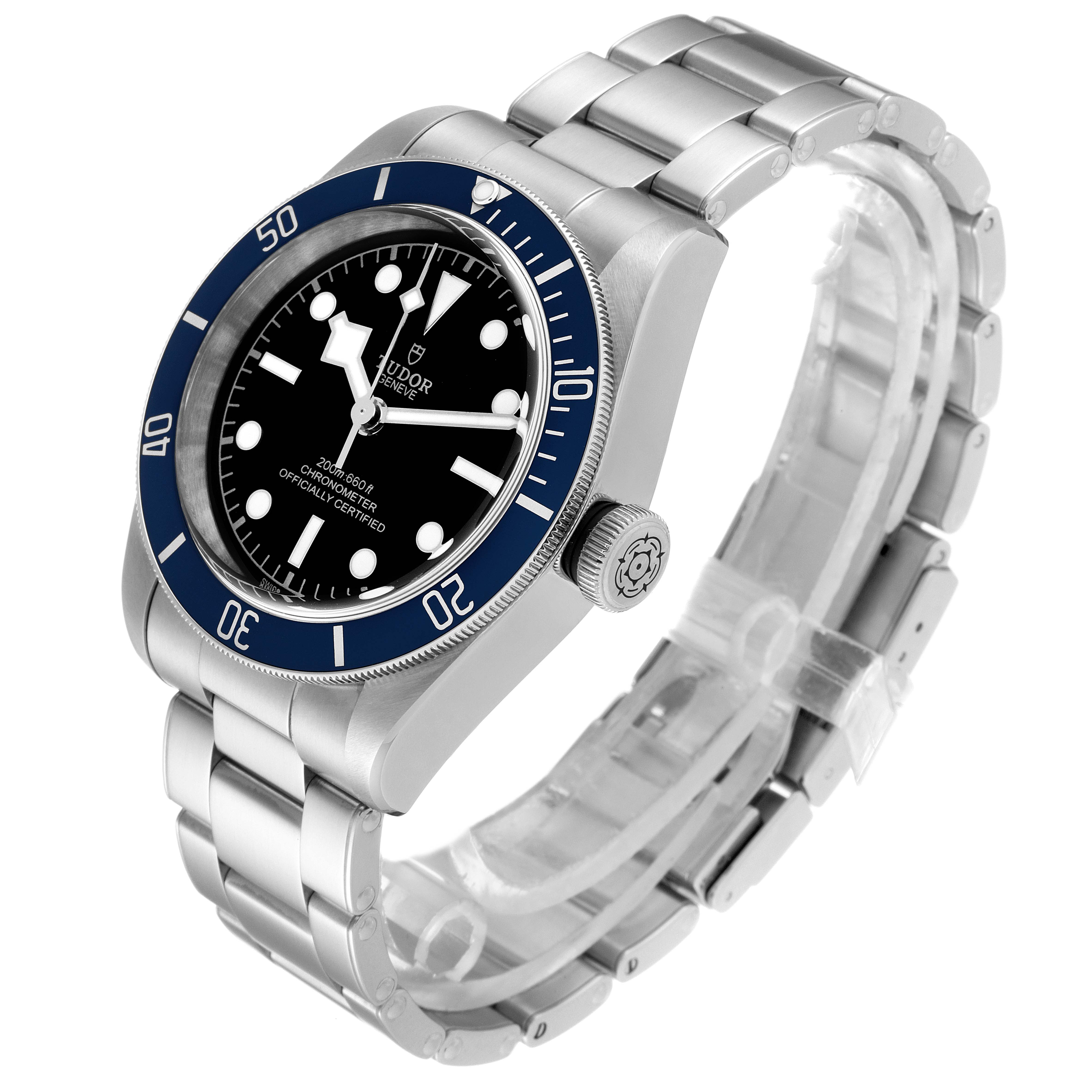 The image shows a Tudor Heritage Black Bay 79230B Men
s Stainless Steel Black Dial 79230B Men
s Stainless Steel Black Dial watch, viewed from an angled perspective, highlighting the bezel, dial, crown, and stainless steel bracelet.