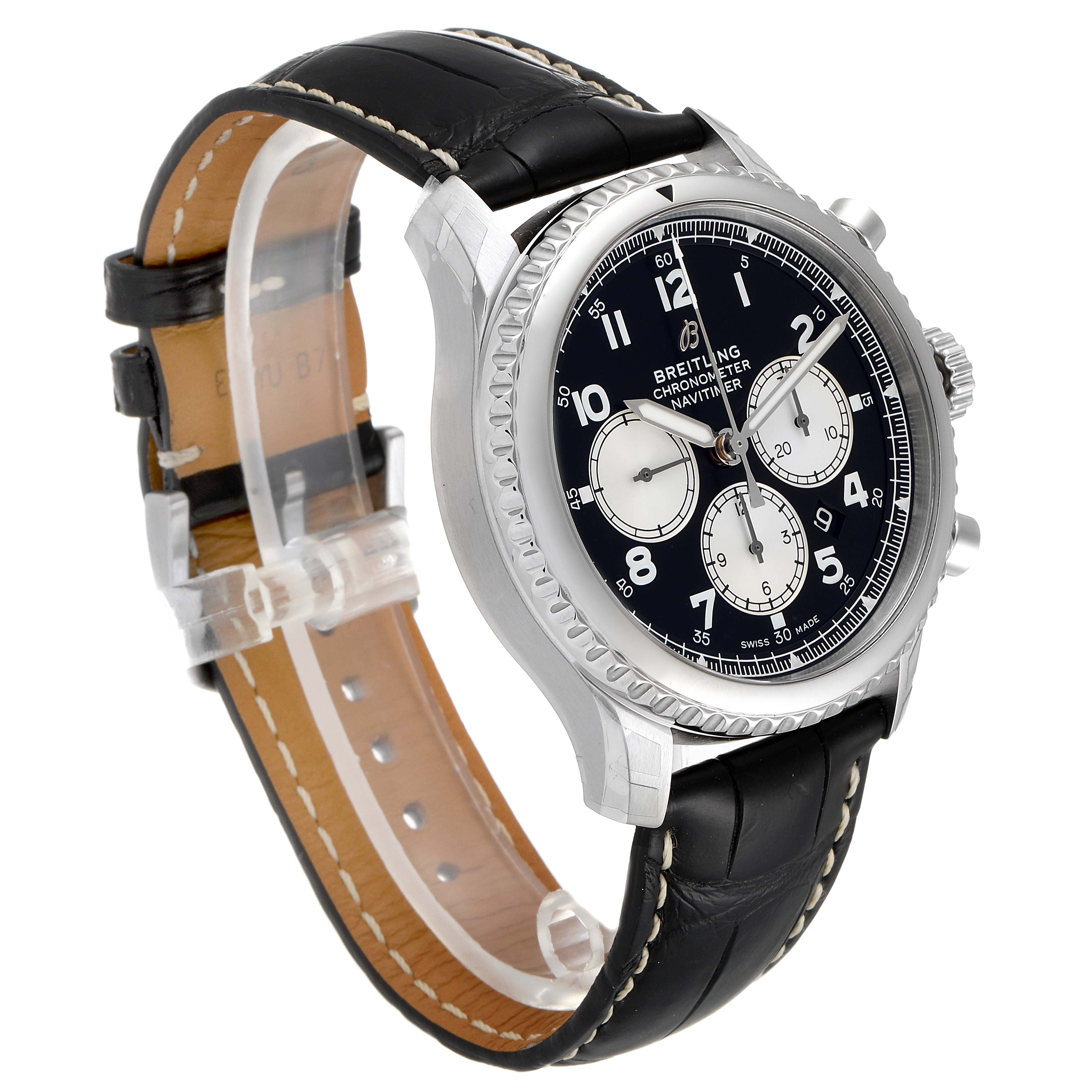 The image shows a Breitling Navitimer watch at a slight side angle, highlighting the face, bezel, and black leather strap.