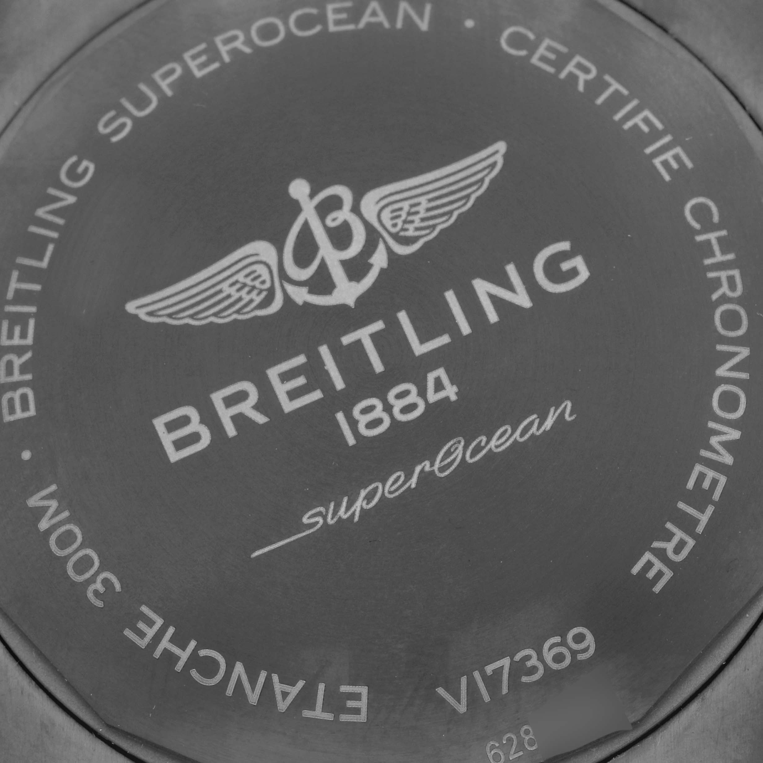 The image shows the case back of the Breitling Superocean V17369 Men's Titanium Blue Dial V17369 Men's Titanium Blue Dial watch, highlighting brand details and specifications.