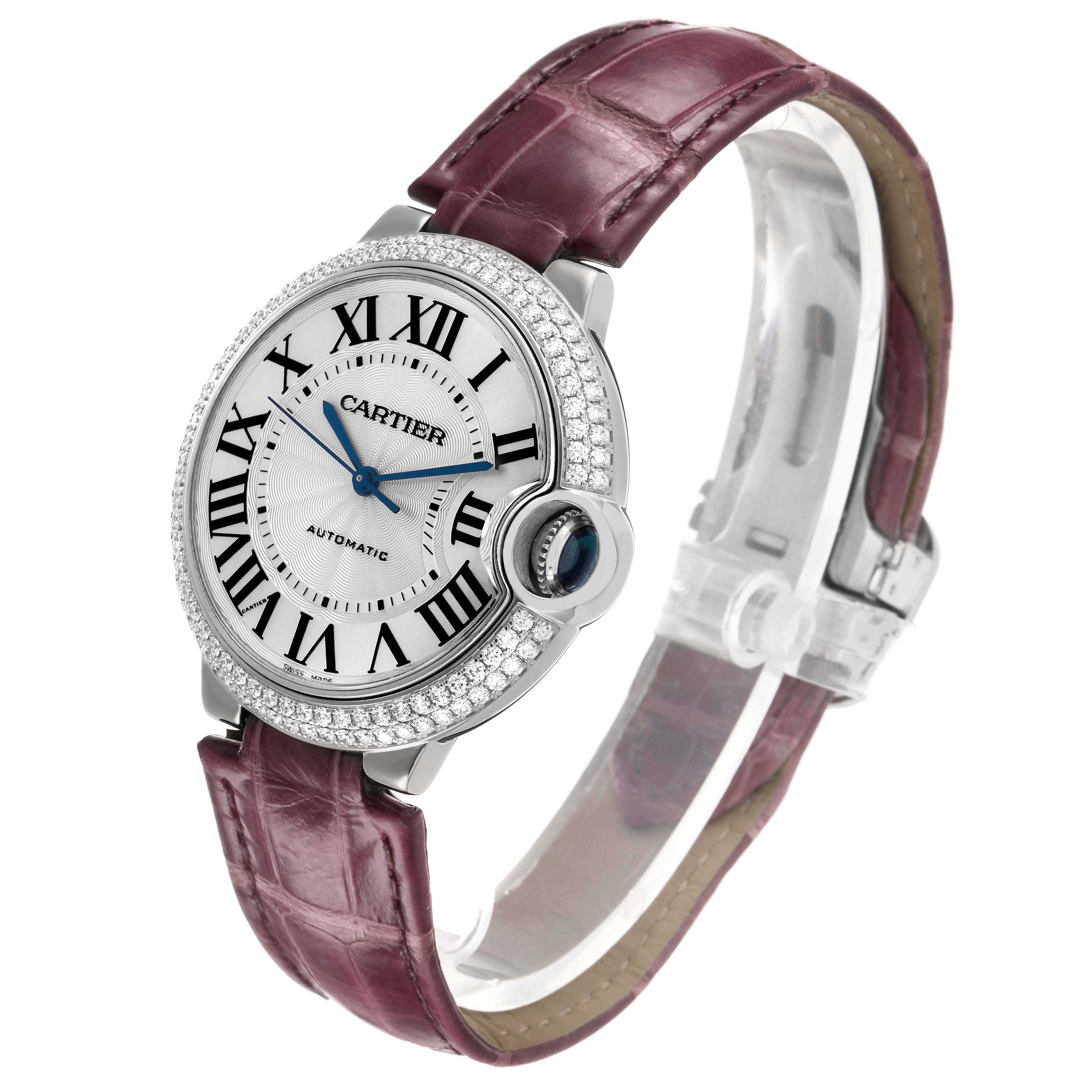 The Cartier Ballon Bleu WE900651 Women's White Gold Silver Dial watch is shown at an angled view, highlighting the bezel, face, and burgundy strap.