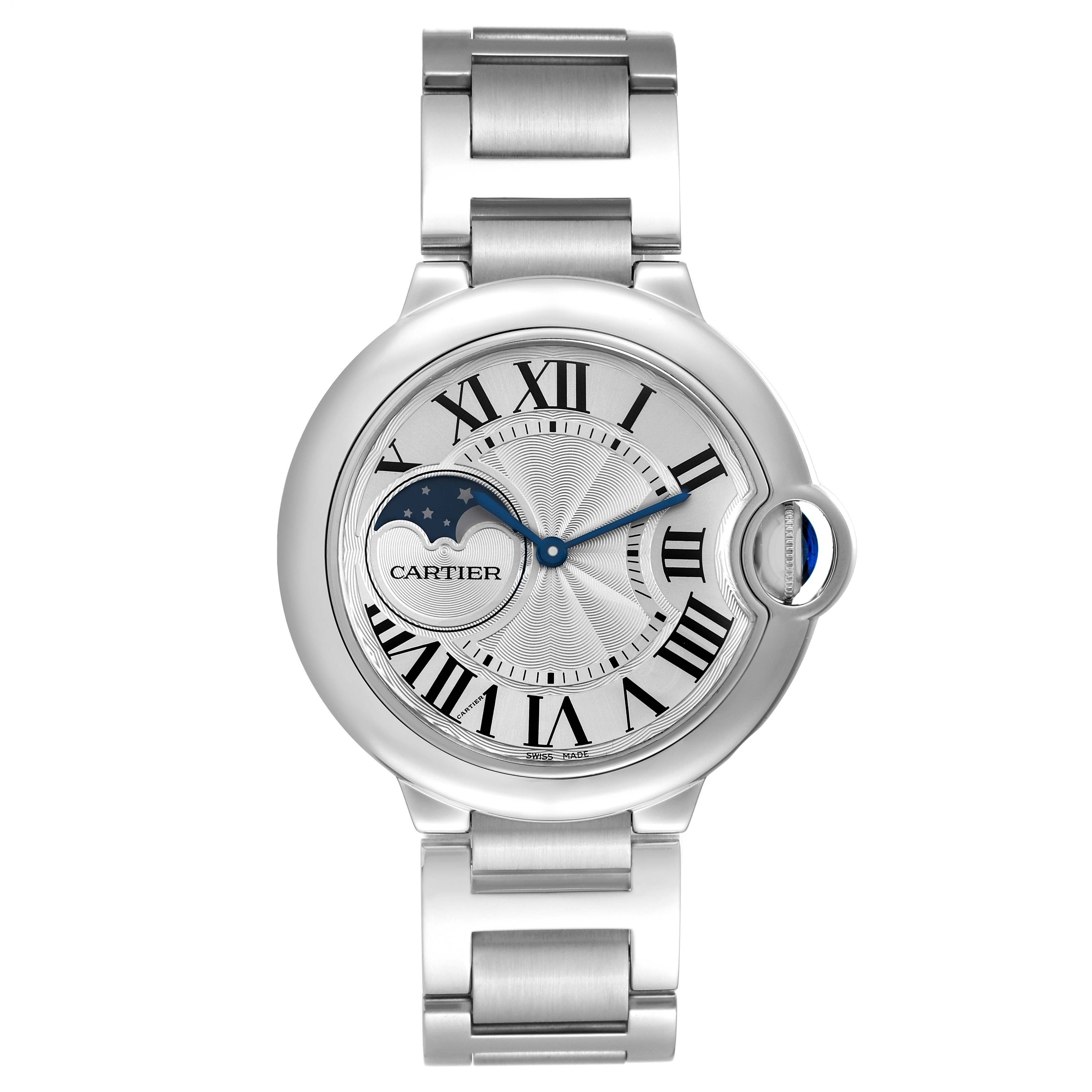 The Cartier Ballon Bleu WSBB0021 Men's Stainless Steel Silver Dial watch is shown from a top view, displaying the dial, Roman numerals, moon phase, and metal bracelet.