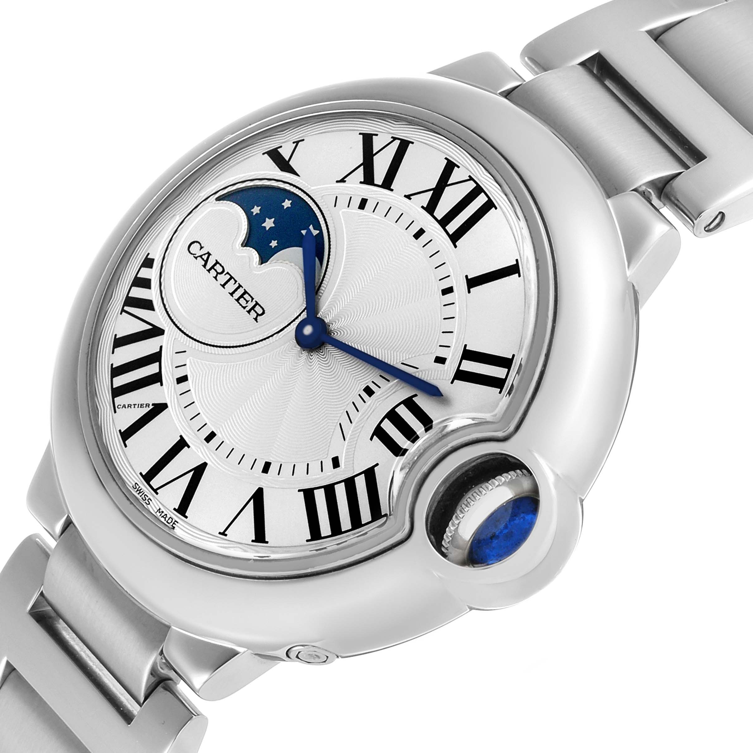 The Cartier Ballon Bleu WSBB0021 Men's Stainless Steel Silver Dial watch is angled to show the face, Roman numerals, moon phase, and distinctive blue cabochon crown.
