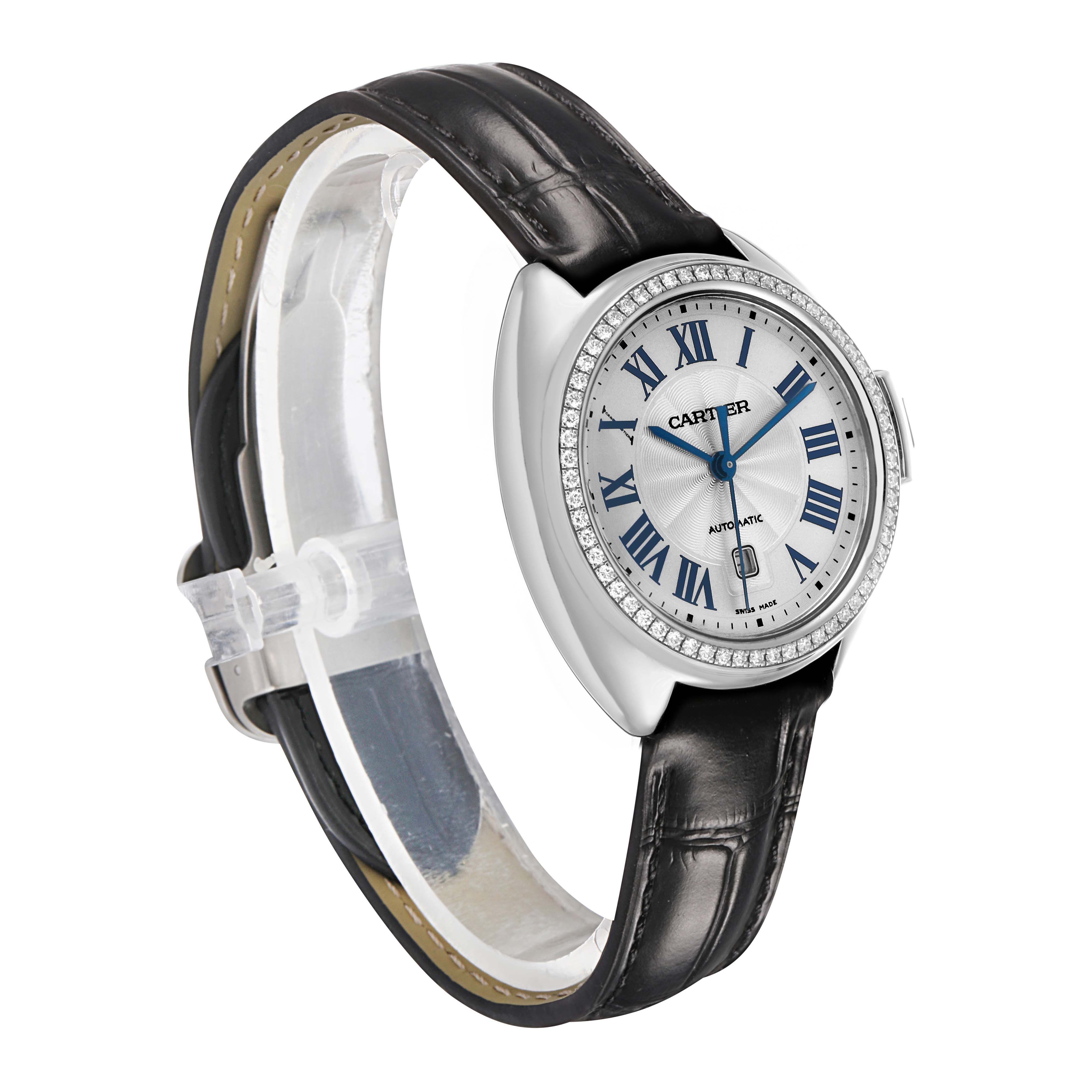 The Cartier Clé watch is shown at a three-quarter angle displaying the dial, bezel, and leather strap.