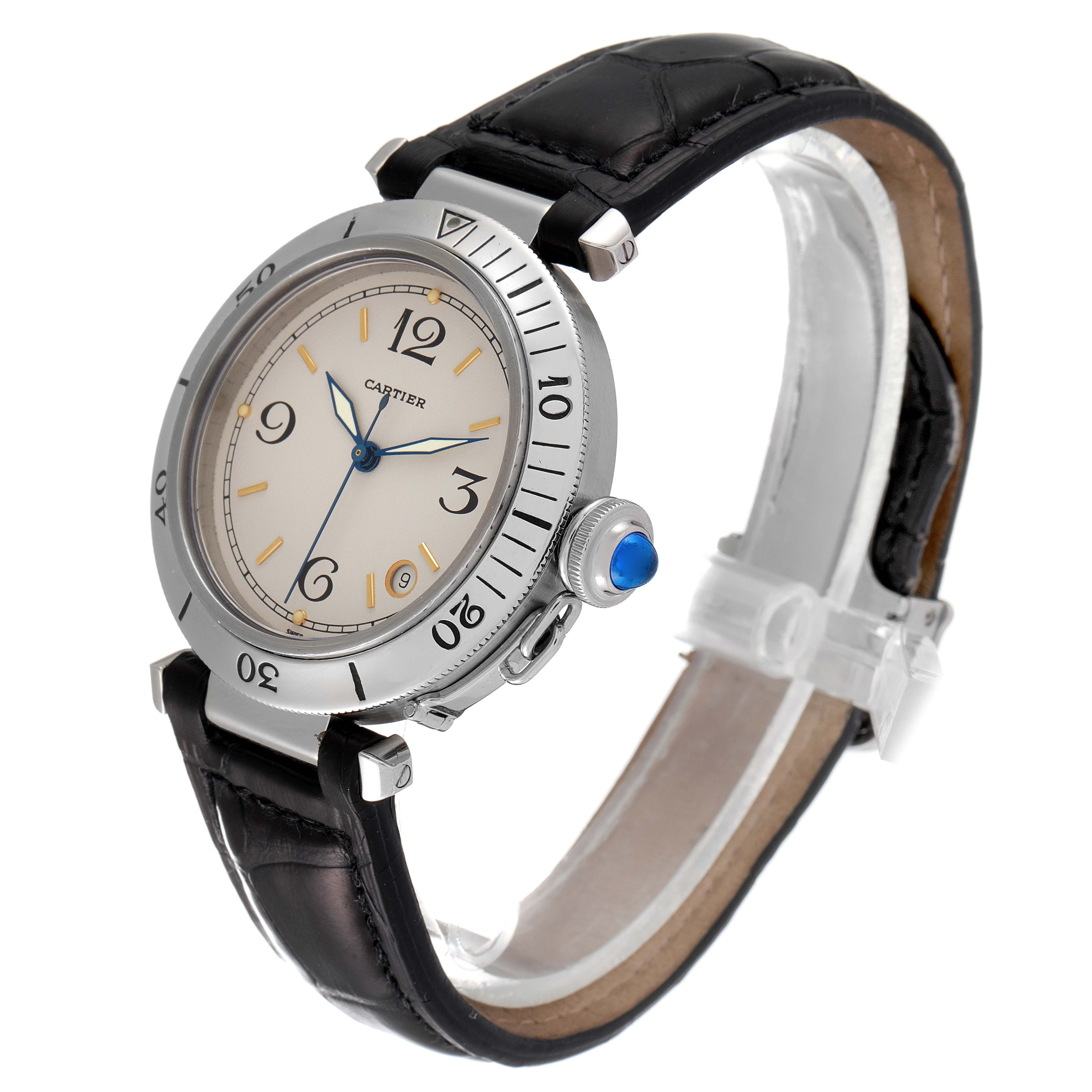 The image shows a side angle of the Cartier Pasha Men's Stainless Steel Beige Dial Men's Stainless Steel Beige Dial watch highlighting the bezel, crown with blue cabochon, dial, and leather strap.