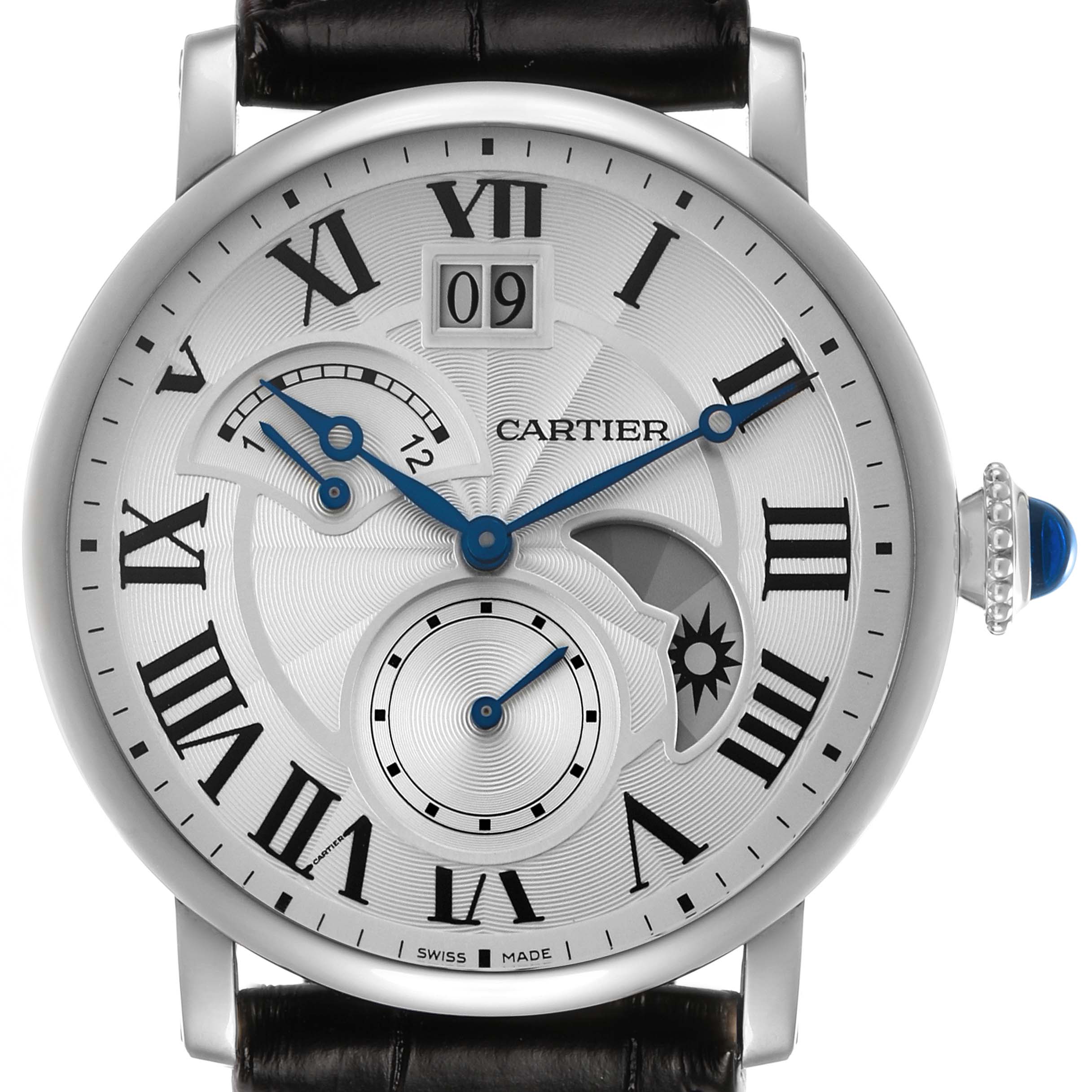The Rotonde de Cartier watch is shown from the front, displaying its face, blue hands, date window, and Roman numerals.