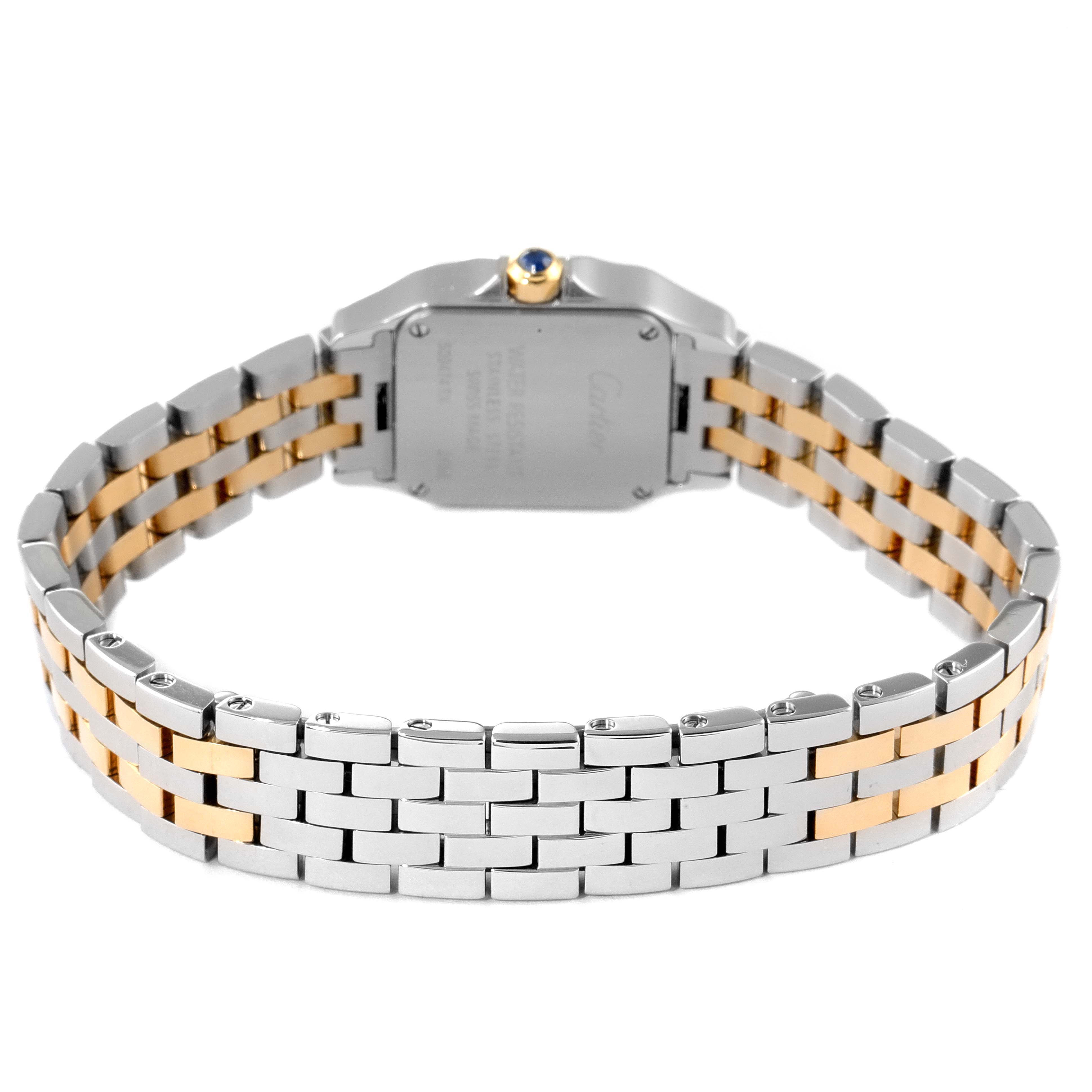 The image shows the backside of the Santos Demoiselle watch by Cartier, focusing on the two-tone metal bracelet and case back.