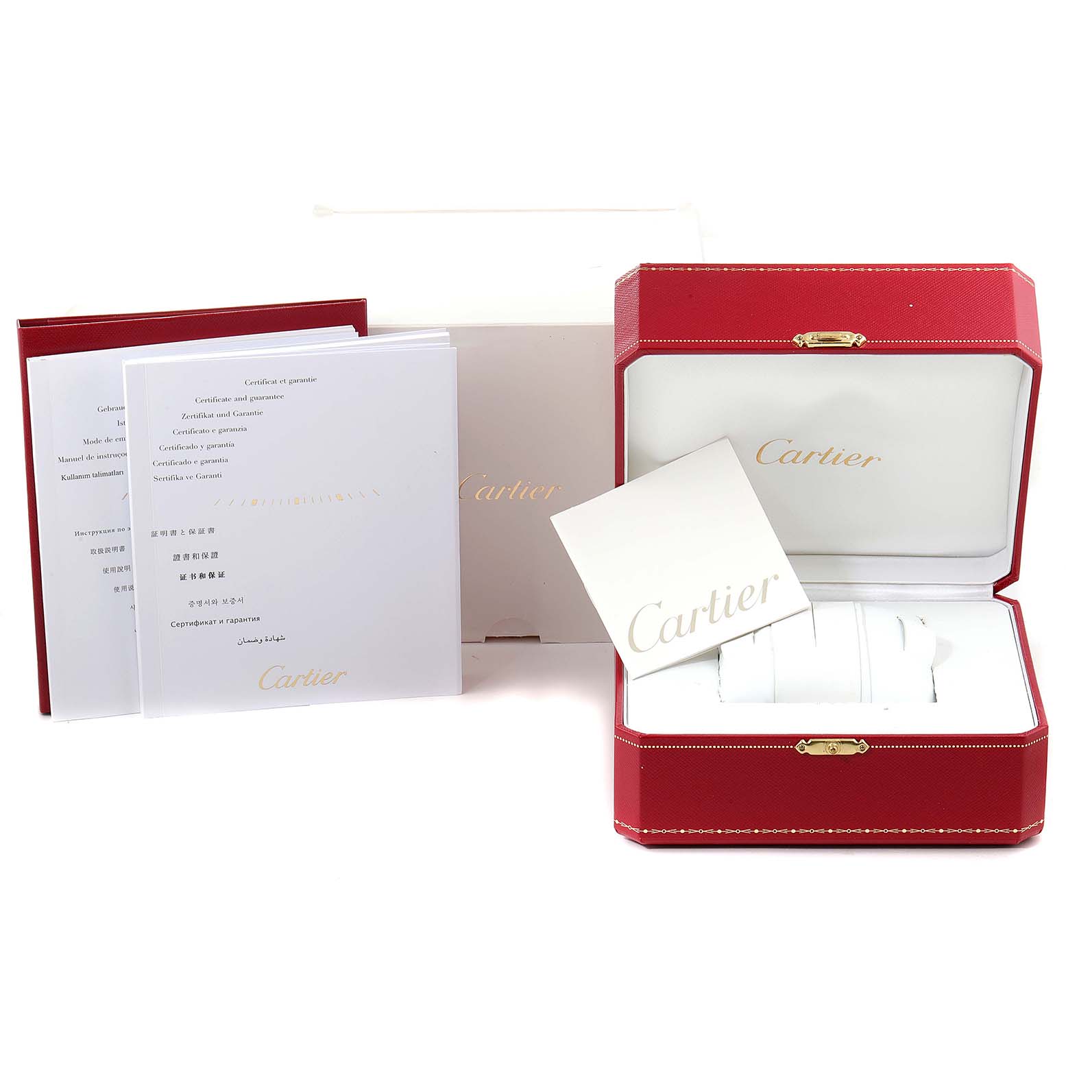 The image shows the packaging, manuals, and a display box for a Santos Demoiselle model by Cartier.