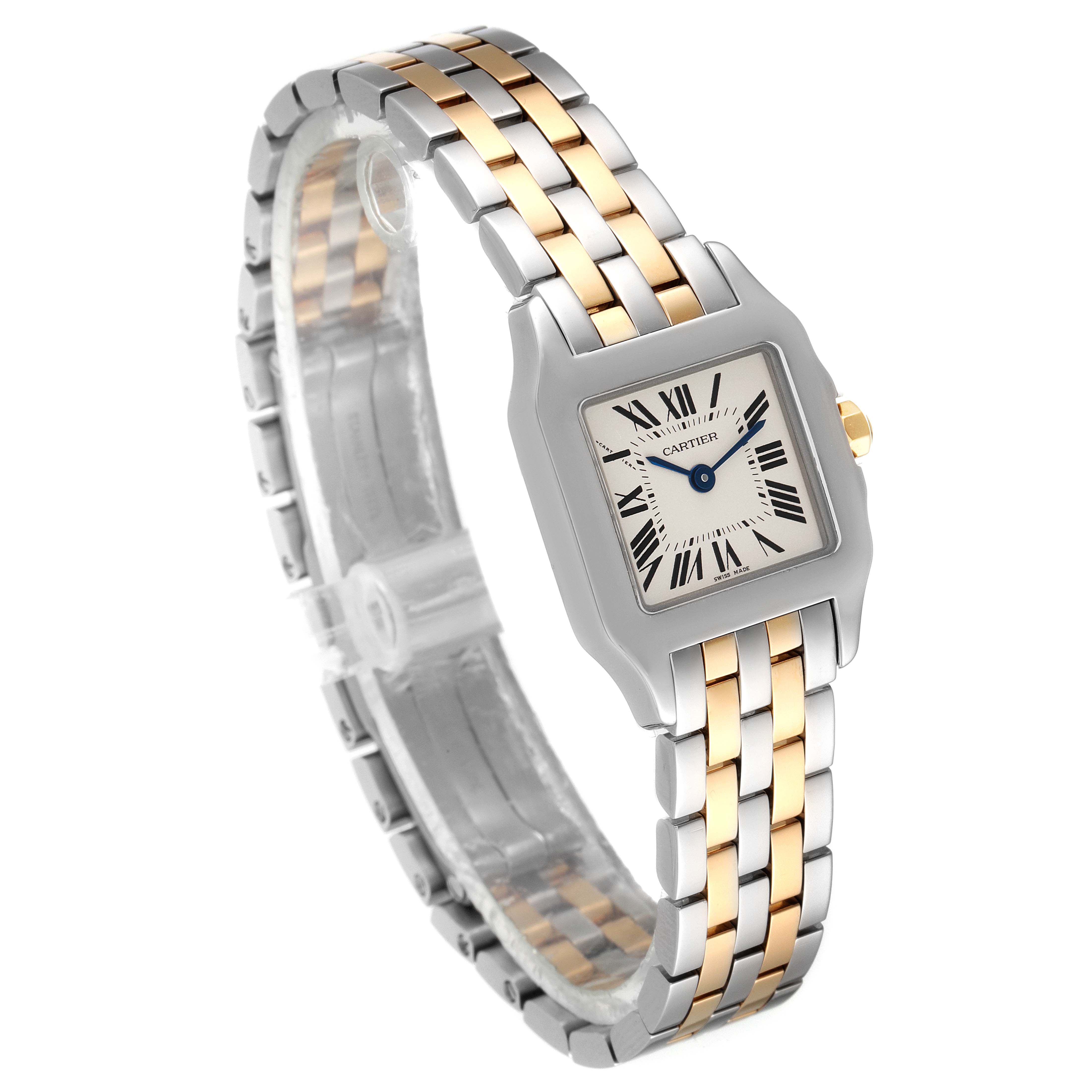The image shows a Cartier Santos Demoiselle W25066Z6 Women's Steel and Gold (two tone) Silver Dial W25066Z6 Women's Steel and Gold (two tone) Silver Dial watch at a tilted angle displaying its face and two-tone bracelet.