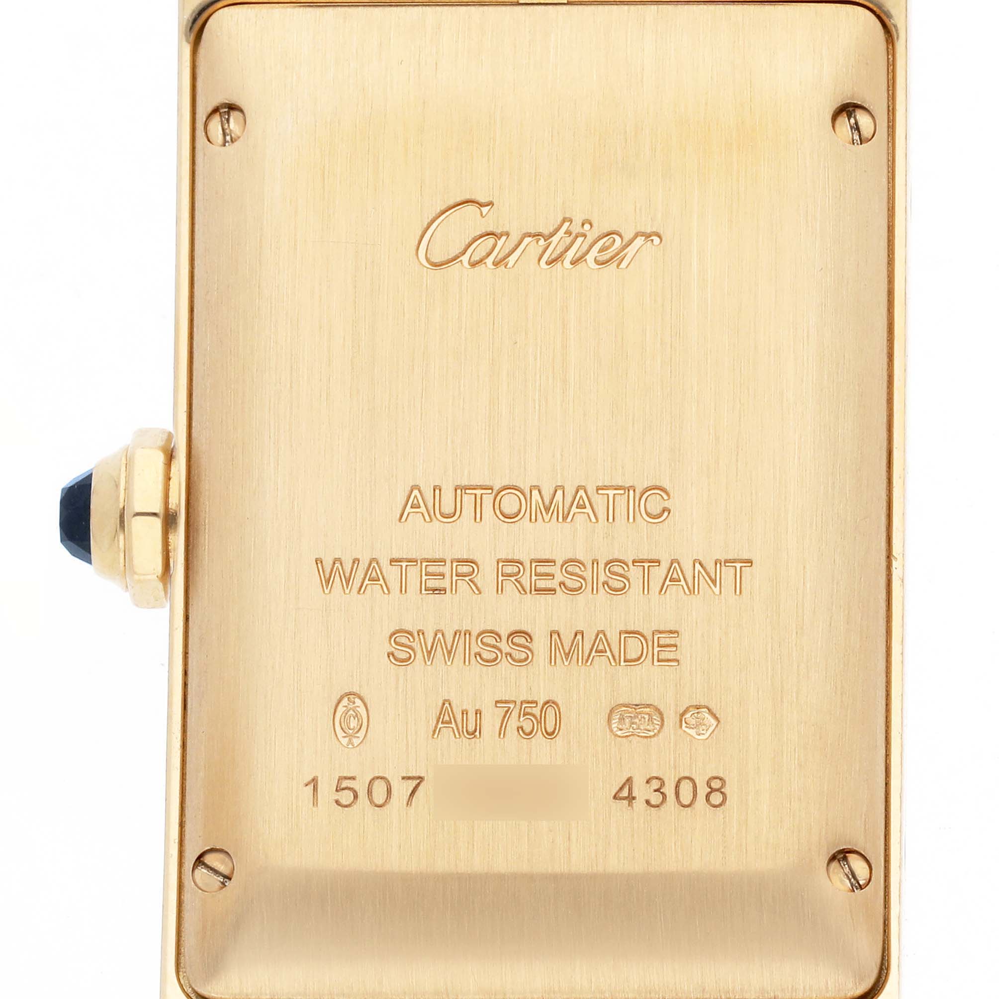 The image shows the back case of a Cartier Tank Americaine WGTA0040 Women's Rose Gold Silver Dial watch, highlighting engravings and the crown with a blue gemstone.