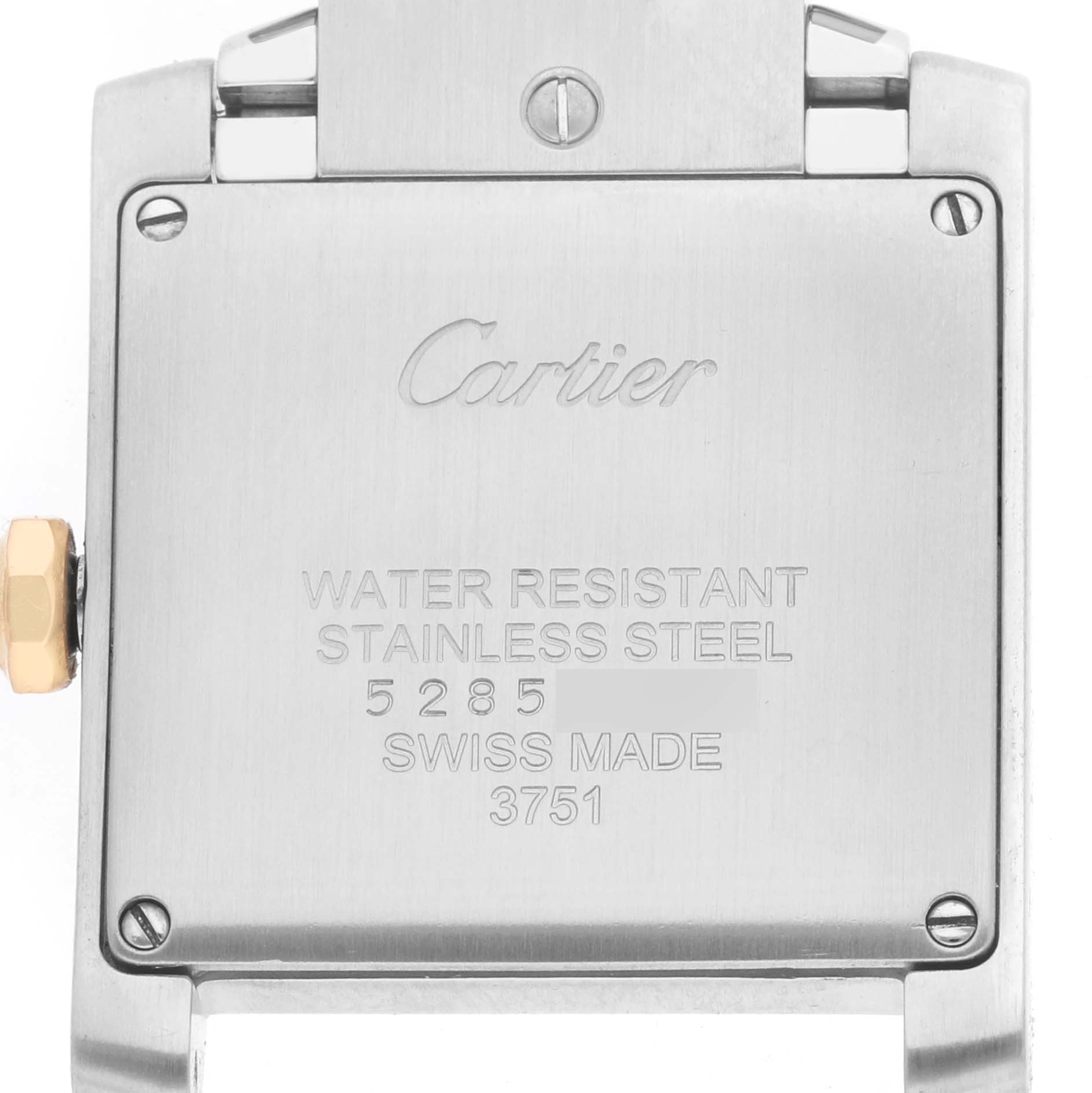 The image shows the back case of a Cartier Tank Francaise WE110005 Women's Stainless Steel Silver Dial watch, focusing on the engravings and the crown.