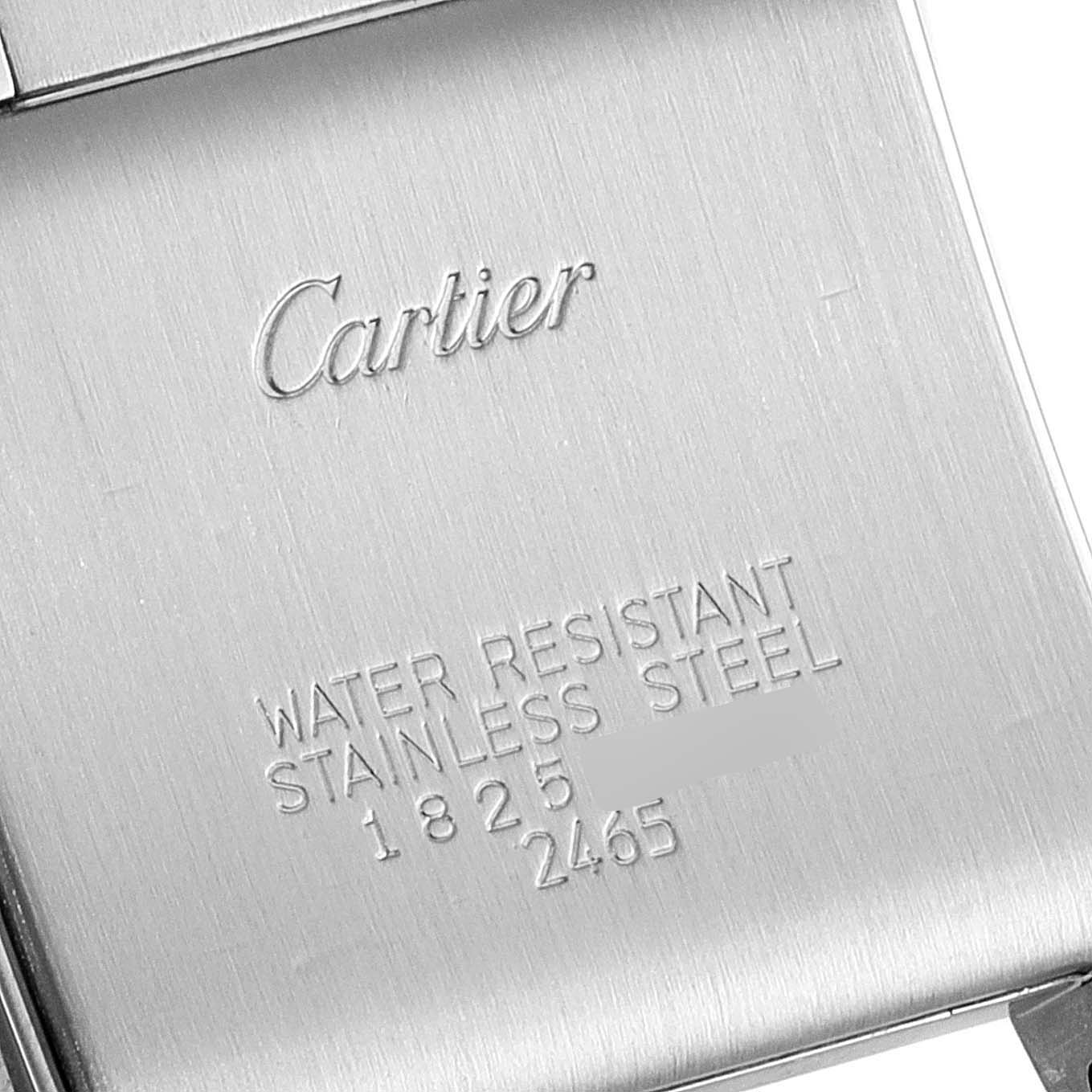 The image shows the backplate of a Cartier Tank Francaise W51012Q4 Women's Steel and Gold (two tone) Silver Dial W51012Q4 Women's Steel and Gold (two tone) Silver Dial watch made of stainless steel.