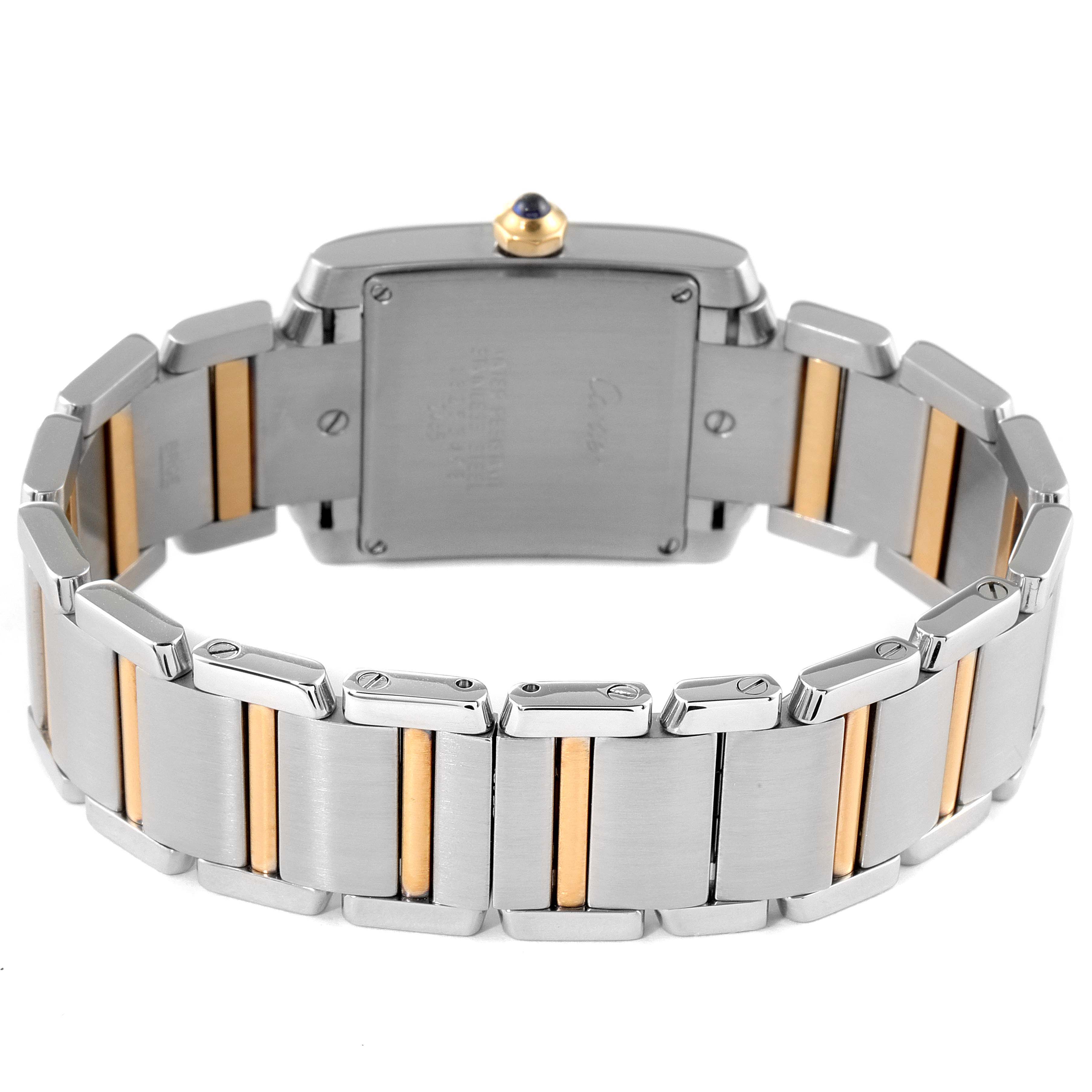The image shows the back angle of the Cartier Tank Française watch, focusing on the bracelet and case back.