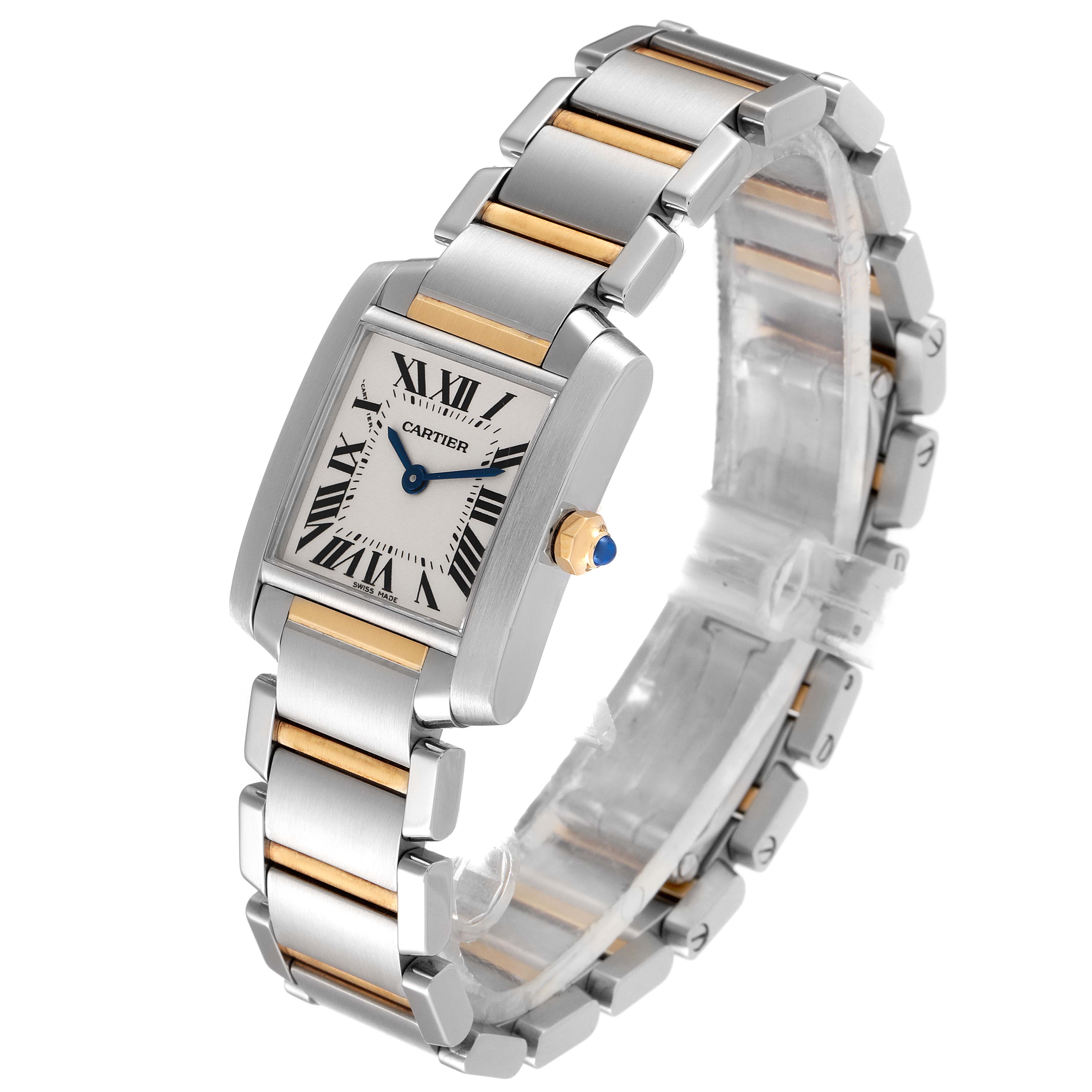 The image shows a Cartier Tank Francaise W51007Q4 Women
s Steel and Gold (two tone) Silver Dial W51007Q4 Women
s Steel and Gold (two tone) Silver Dial watch at a slight angle, highlighting its rectangular dial, two-tone bracelet, and blue cabochon crown.
