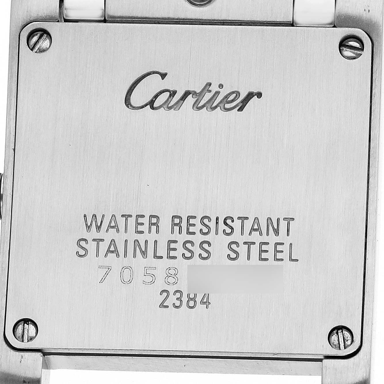 The image shows the back case of a Cartier Tank Française watch, displaying branding and specifications.