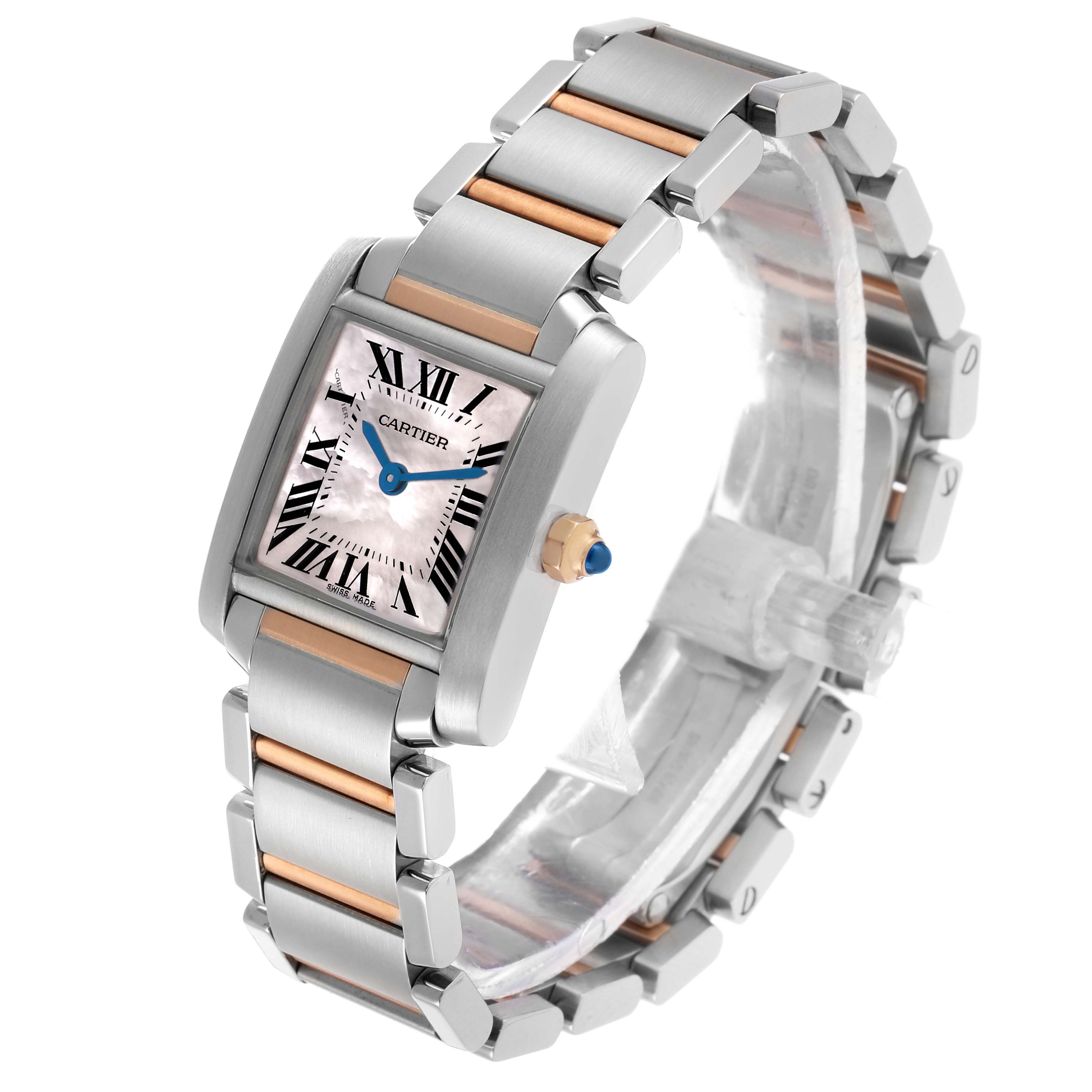 The Cartier Tank Française watch is shown at an oblique angle, highlighting its case, bracelet, and crown with blue cabochon.