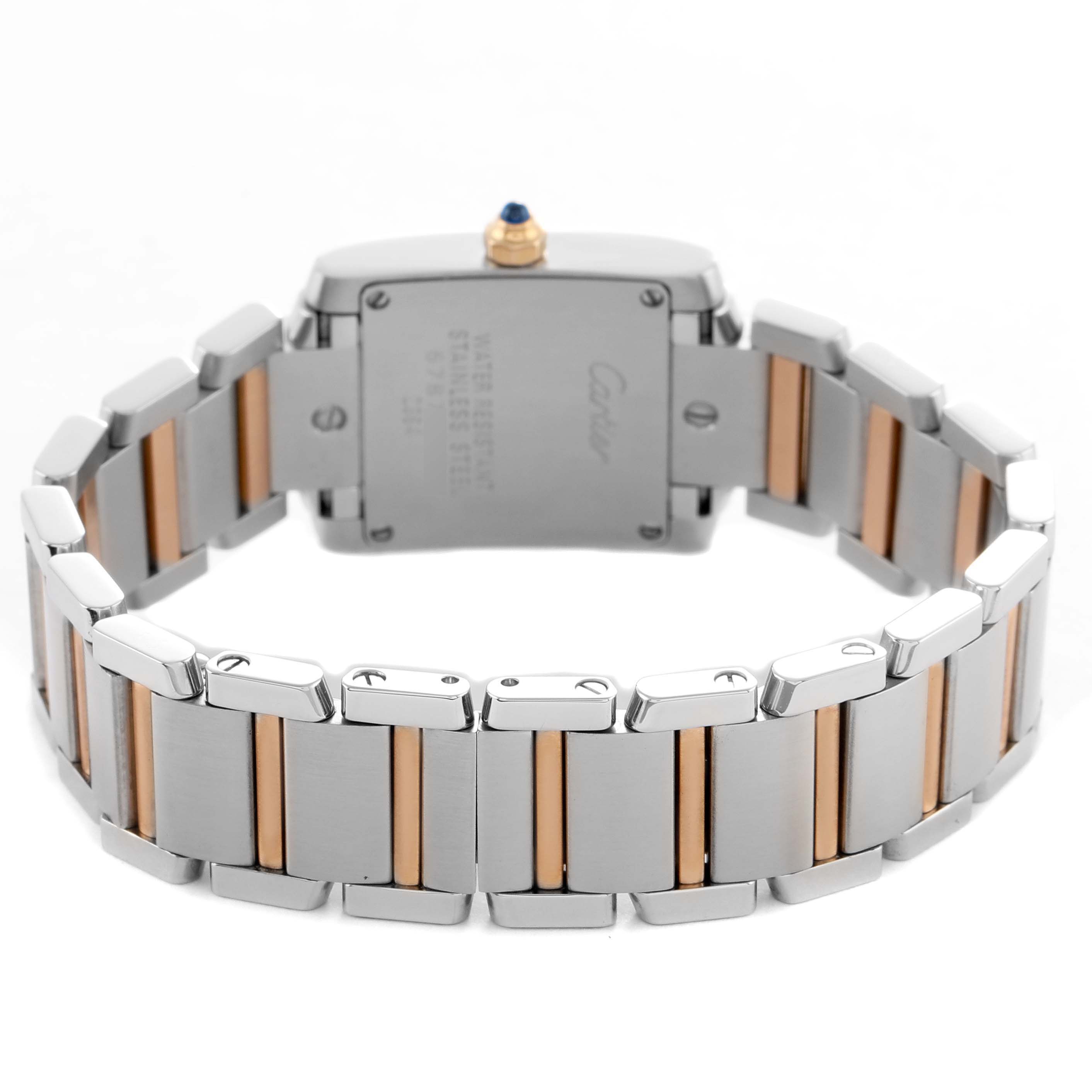 The image shows the back of the Cartier Tank Française watch, highlighting the stainless steel and gold bracelet with the clasp open.