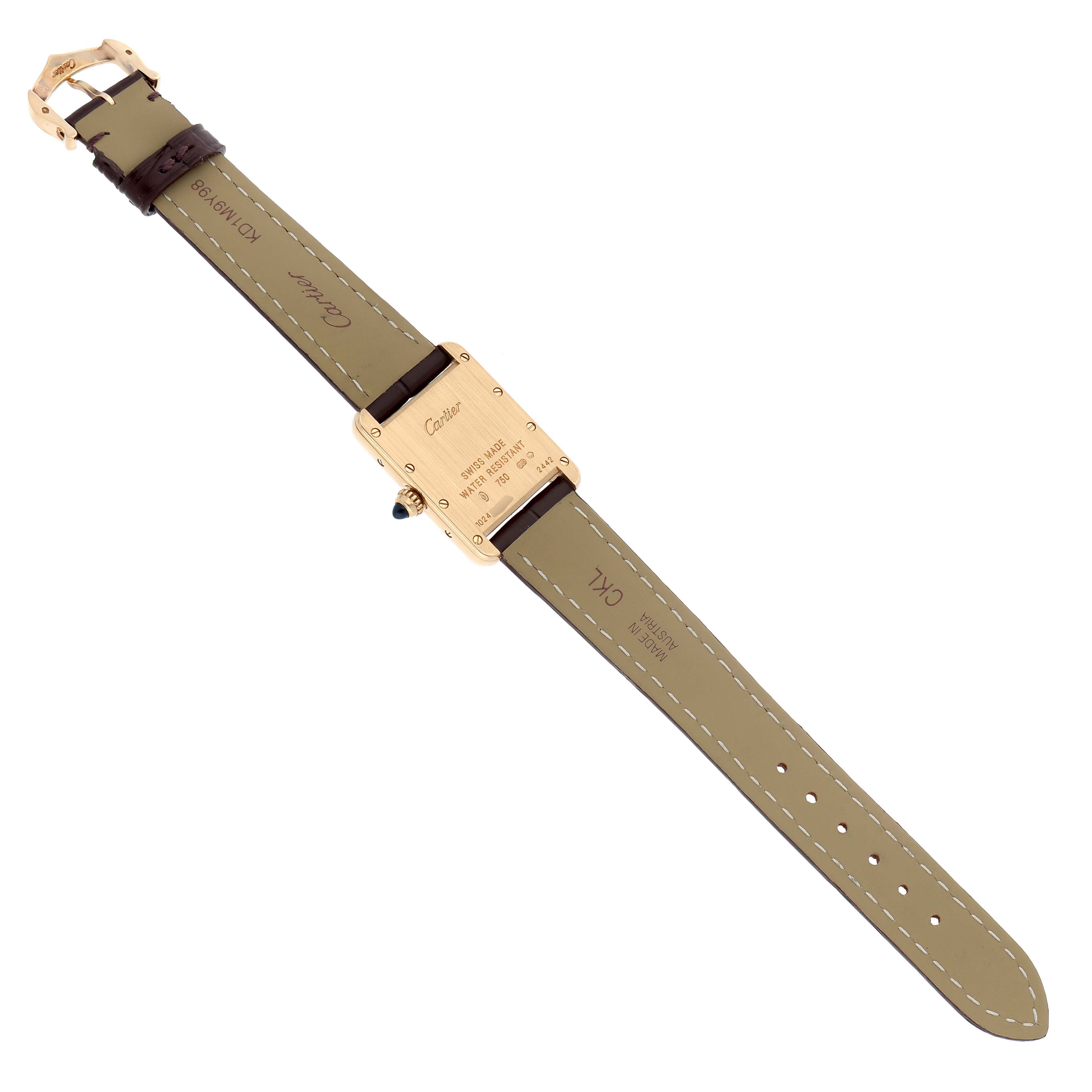 The Cartier Tank Louis W1529856 Women's Yellow Gold Silver Dial watch is shown from the back, highlighting its clasp, strap, and case back details.