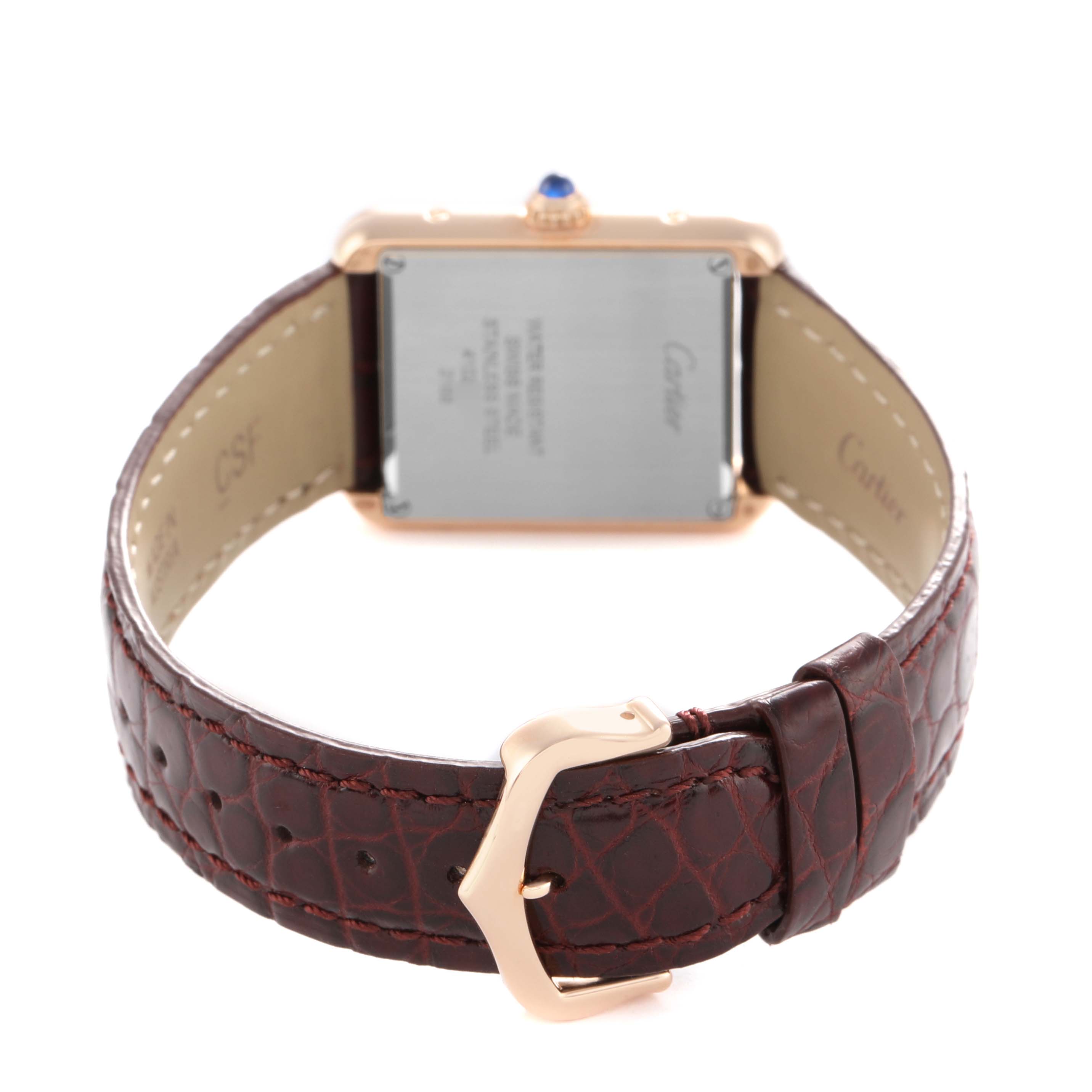 The image shows the back view of a Cartier Tank Solo W5200024 Women's Rose Gold Silver Dial watch, highlighting the case back and brown leather strap with a buckle.