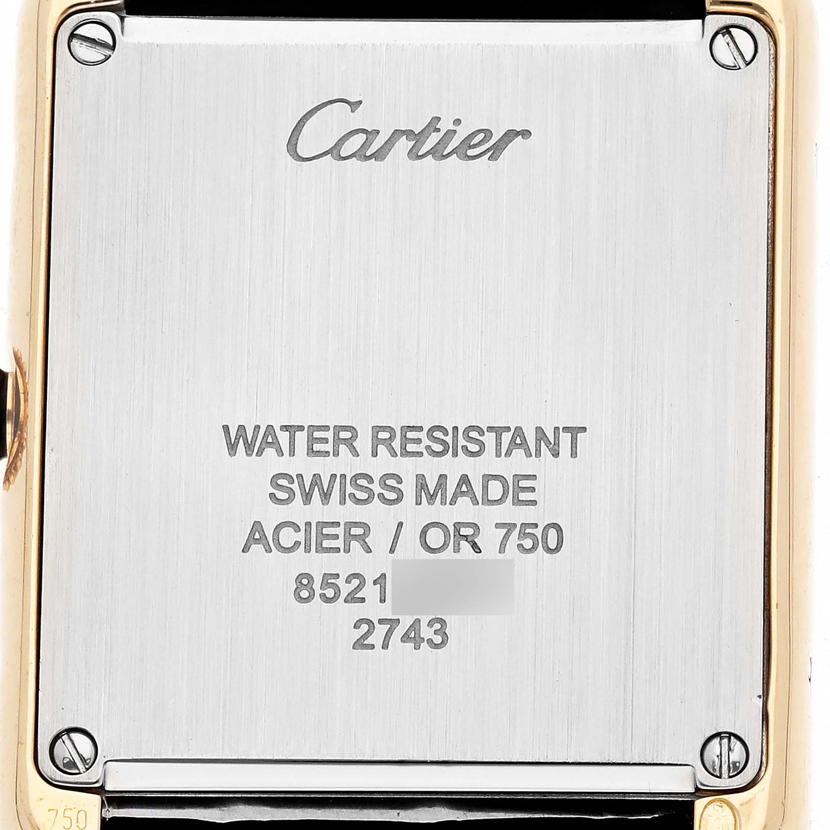The image shows the back case of the Cartier Tank Solo W1018755 Women's Yellow Gold Silver Dial watch, displaying the brand name and specifications.