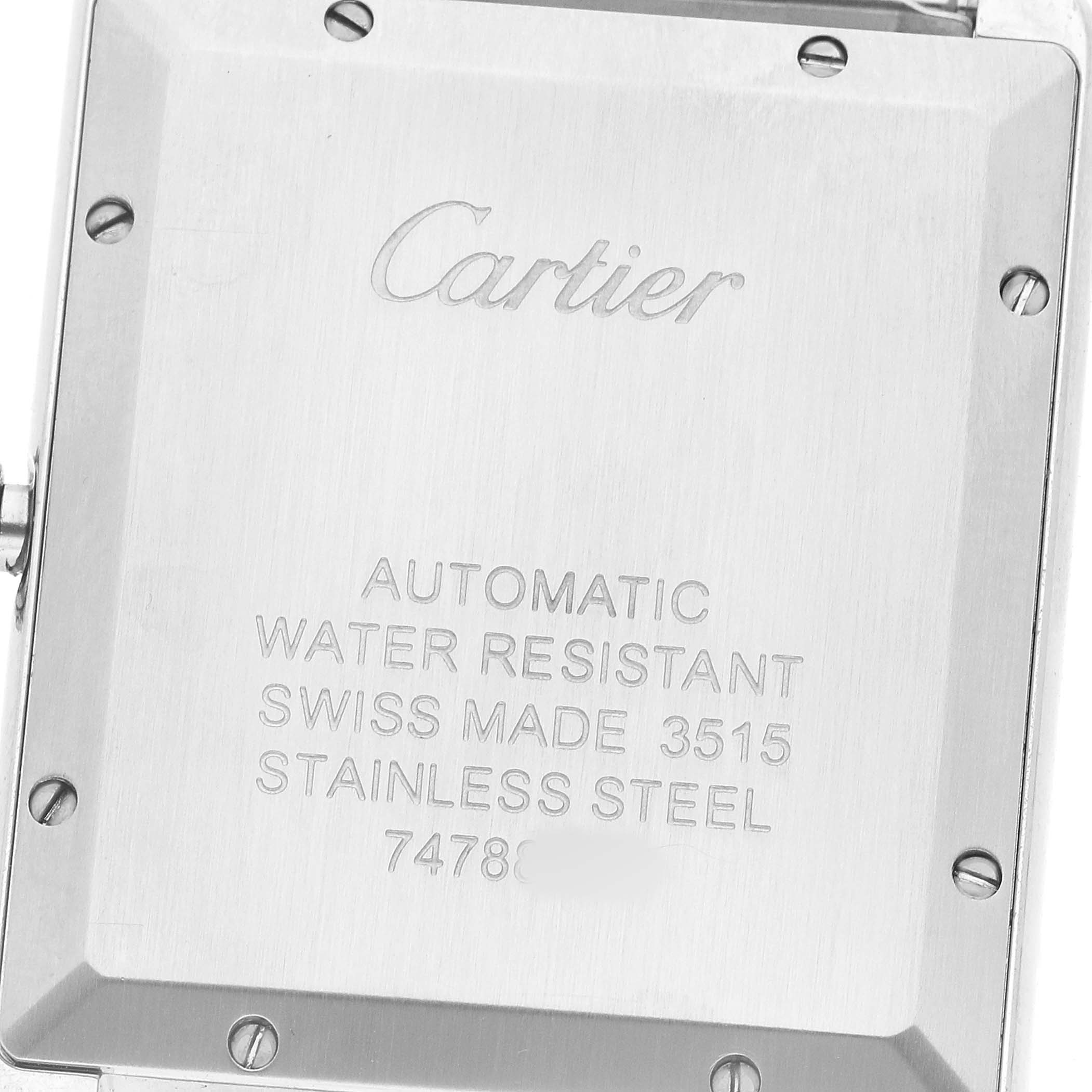 The image shows the back of a Cartier Tank Solo W5200028 Men's Stainless Steel Silver Dial watch with engraved details and screws.