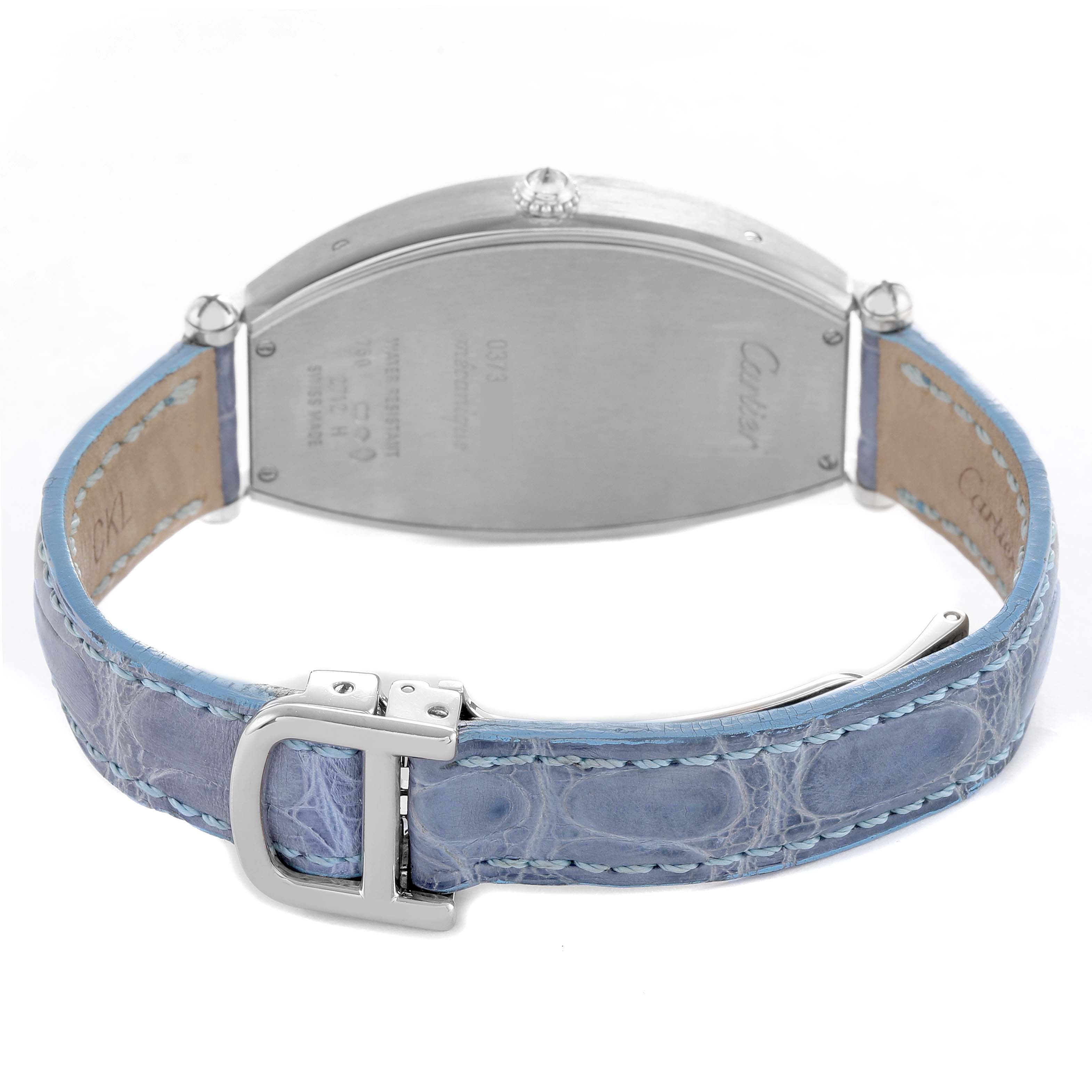 The Cartier Tonneau WE400251 Women's White Gold Silver Dial watch is shown from the back, highlighting the case back, crown, and blue leather strap with clasp.