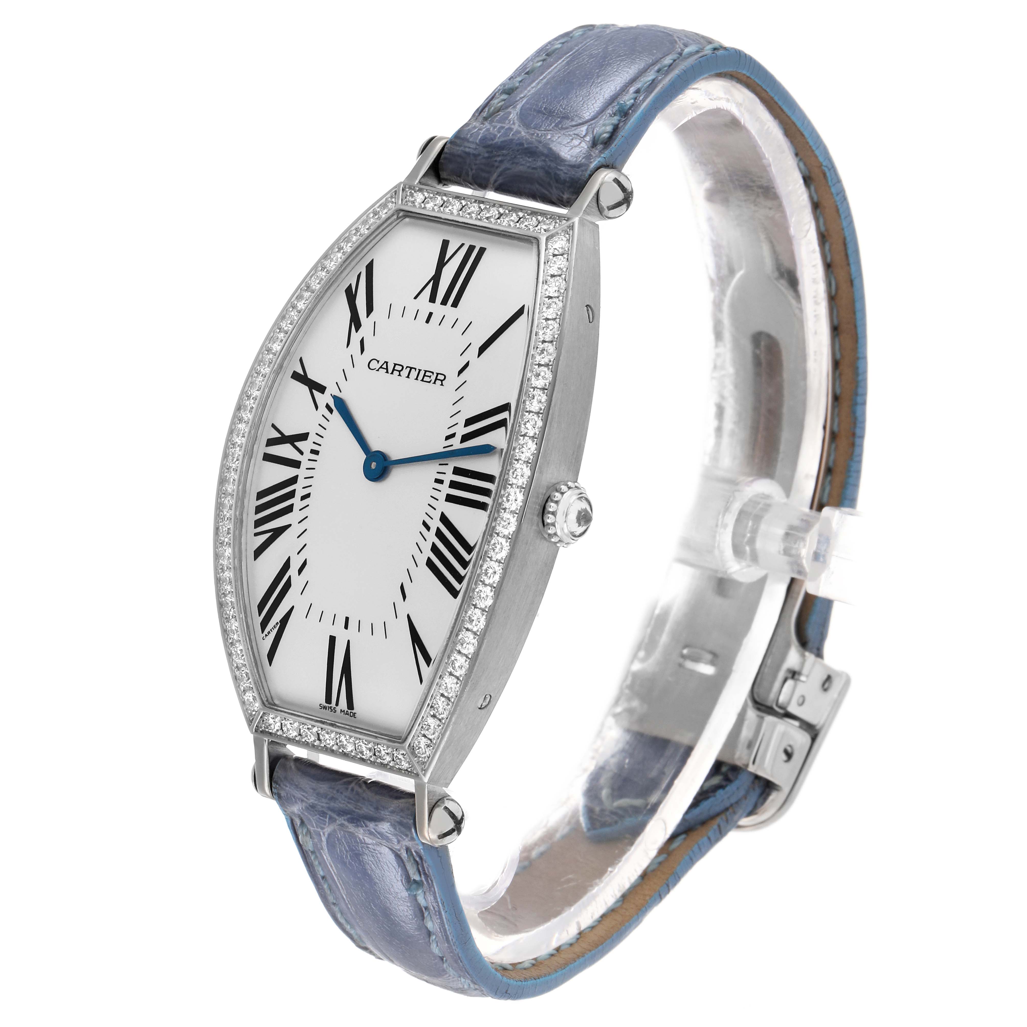 The Cartier Tonneau WE400251 Women's White Gold Silver Dial watch is shown from a three-quarter angle, displaying its face, case, crown, and strap.