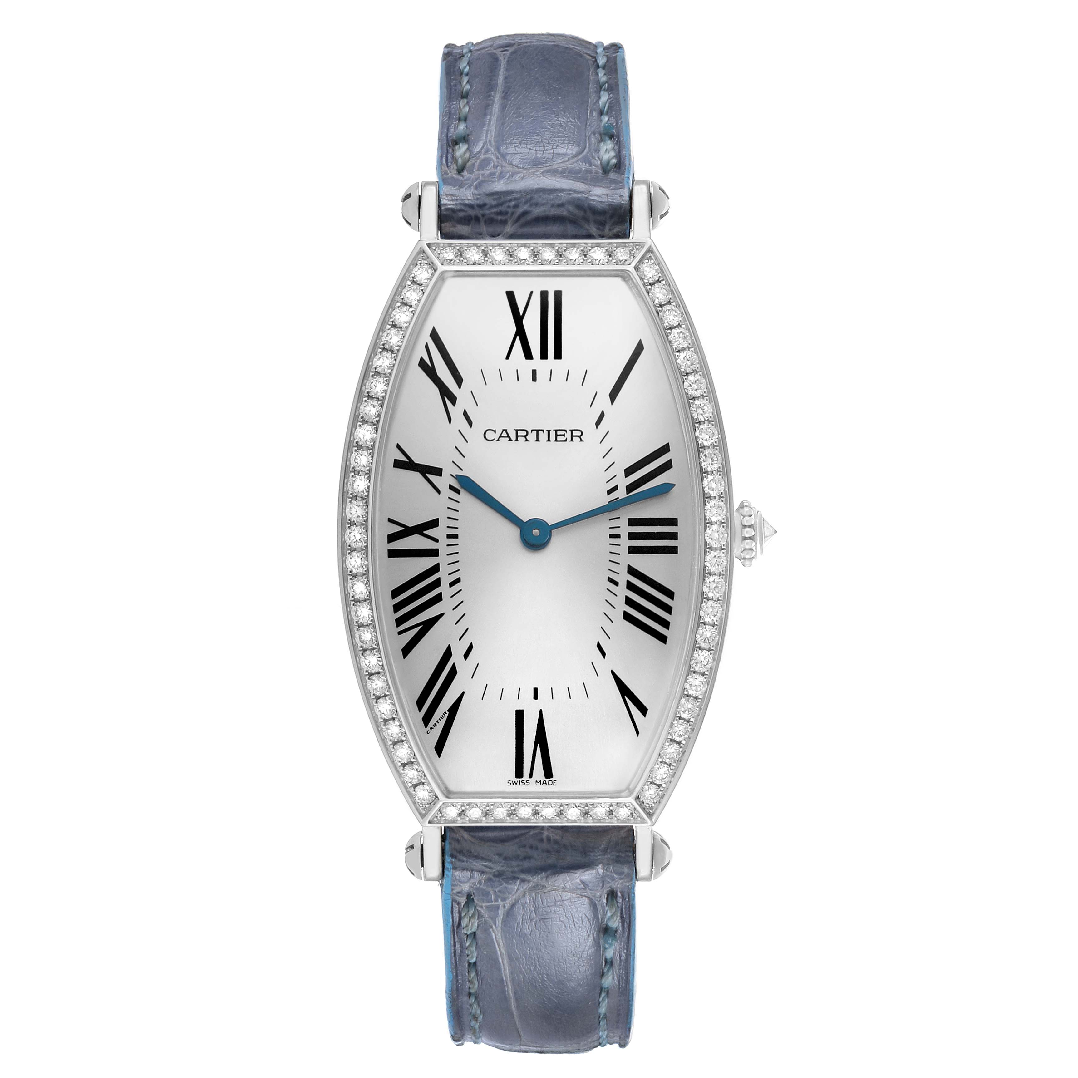 The Cartier Tonneau WE400251 Women's White Gold Silver Dial model is shown from the front, displaying its elongated case, Roman numeral dial, and leather strap.