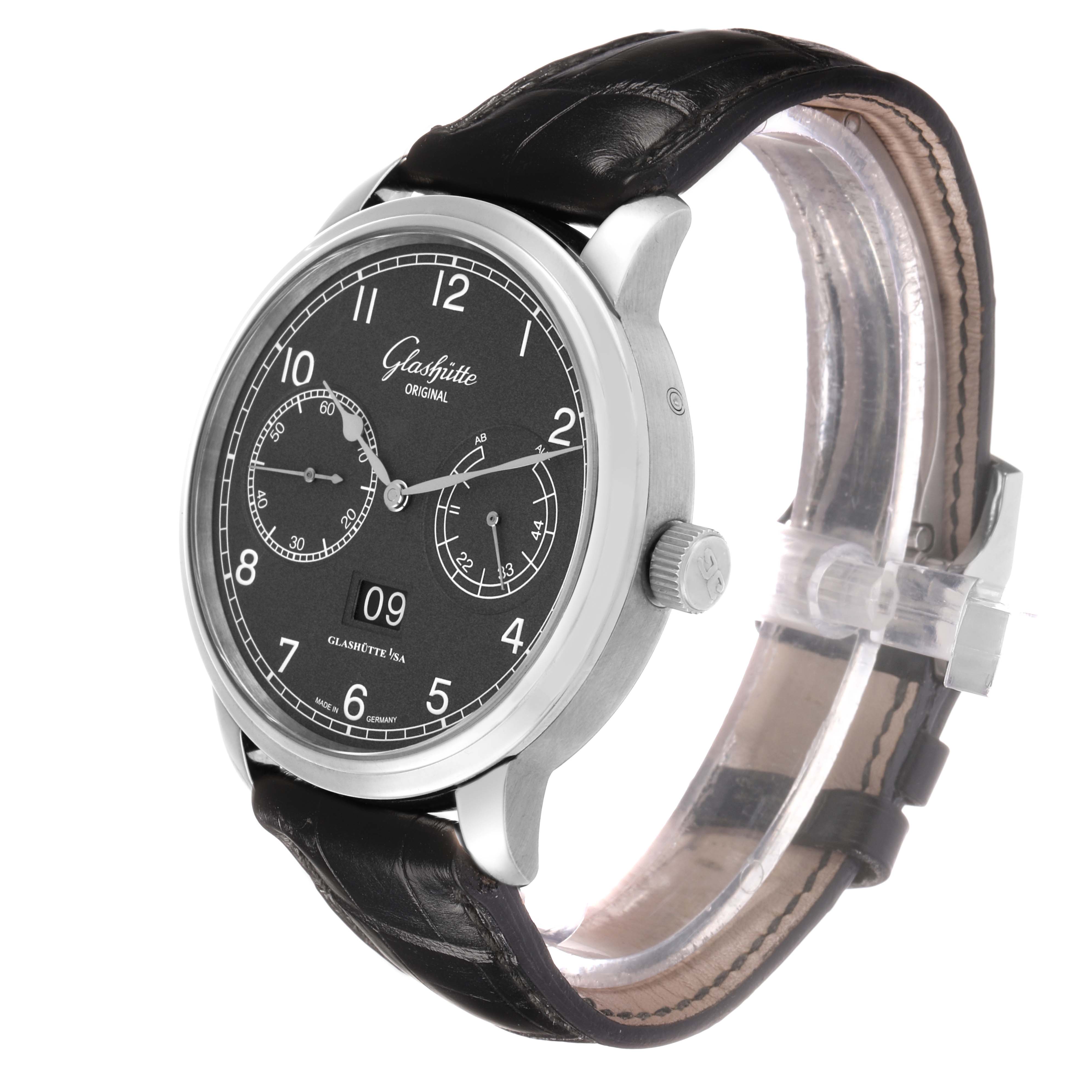 The Glashütte Senator watch is shown from a front-left angle, highlighting the dial, crown, and leather strap.