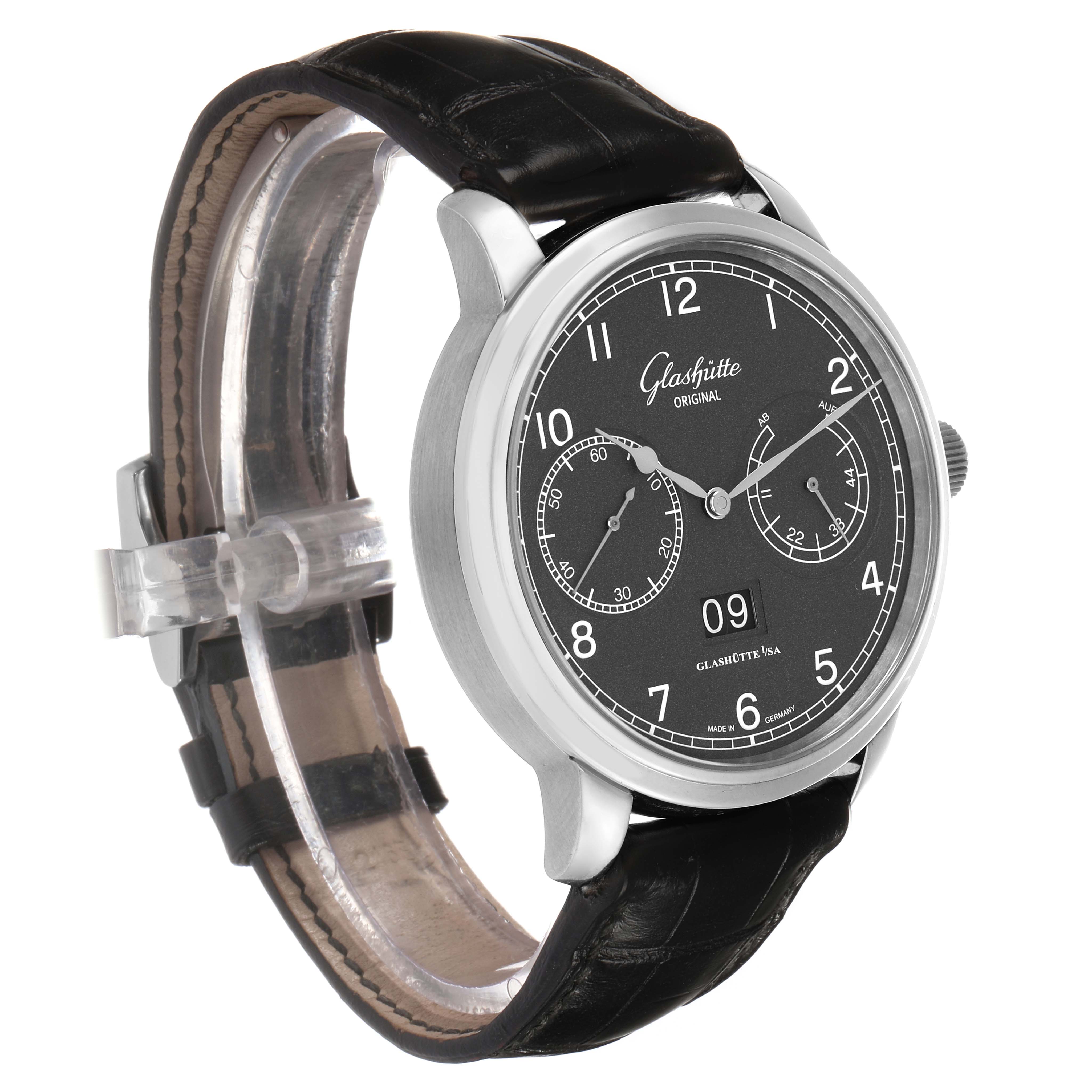 The Glashütte Senator watch is shown at an angled front view, highlighting its black dial and leather strap.