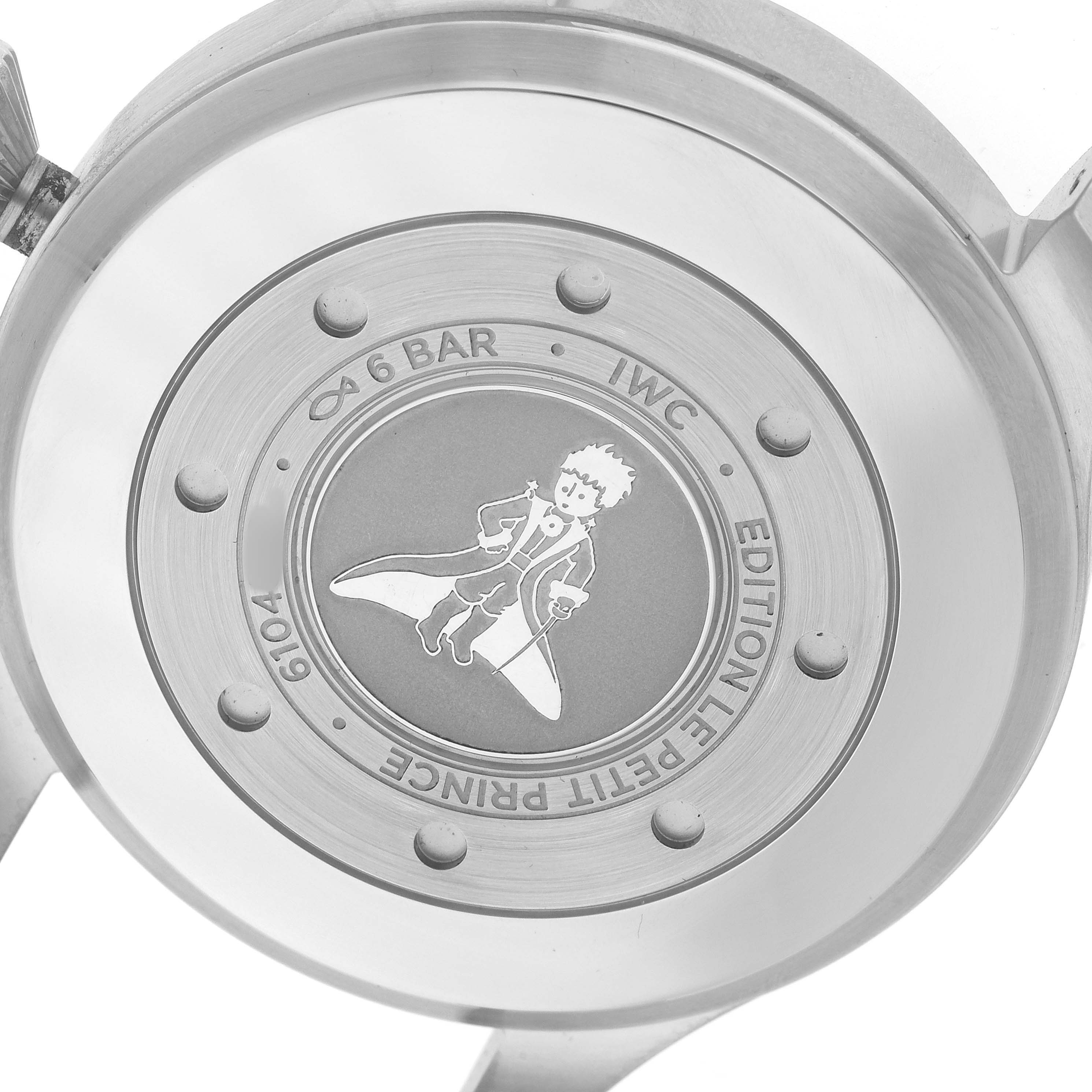 The image shows the back case of an IWC Pilot IW501002 Men's Stainless Steel Blue Dial watch, featuring the "Le Petit Prince" engraving.