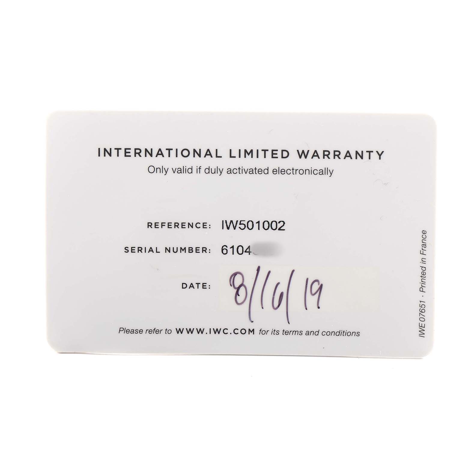 The image shows an IWC Pilot IW501002 Men's Stainless Steel Blue Dial model's International Limited Warranty card with reference and serial number details.