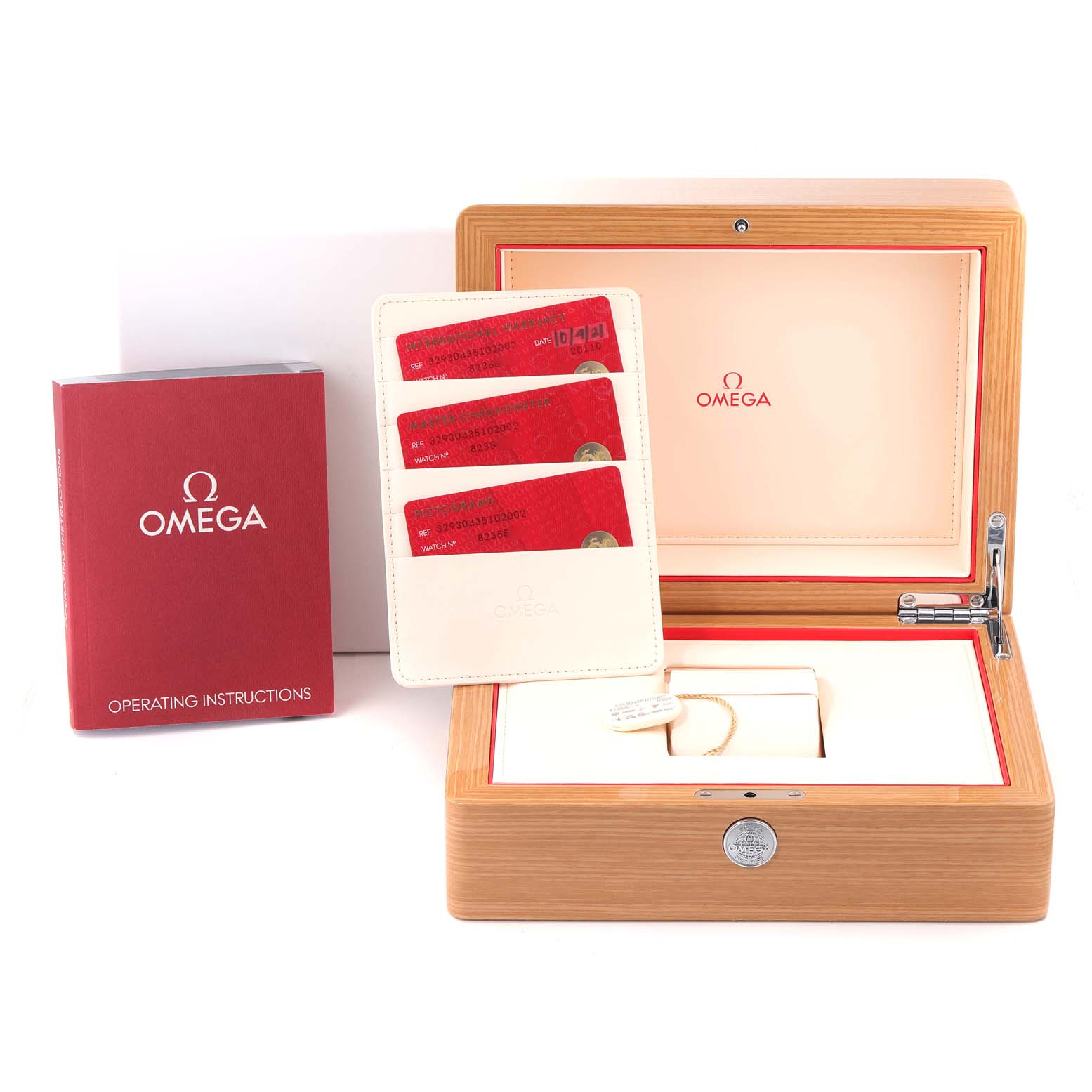 The image shows the packaging, warranty cards, and operating instructions for an Omega Speedmaster 329.30.43.51.02.002 Men's Stainless Steel Silver Dial 329.30.43.51.02.002 Men's Stainless Steel Silver Dial watch.