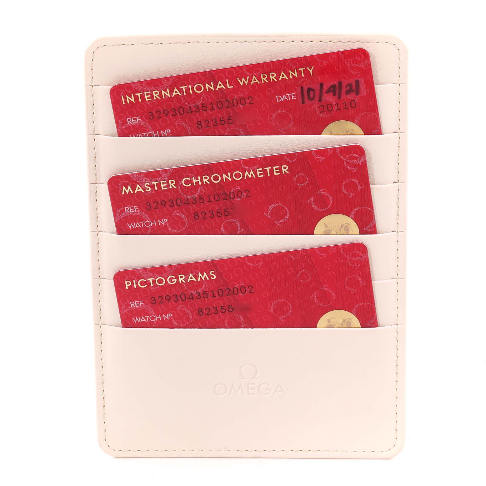 The image shows the warranty cards for the Omega Speedmaster 329.30.43.51.02.002 Men's Stainless Steel Silver Dial 329.30.43.51.02.002 Men's Stainless Steel Silver Dial model in a white cardholder.