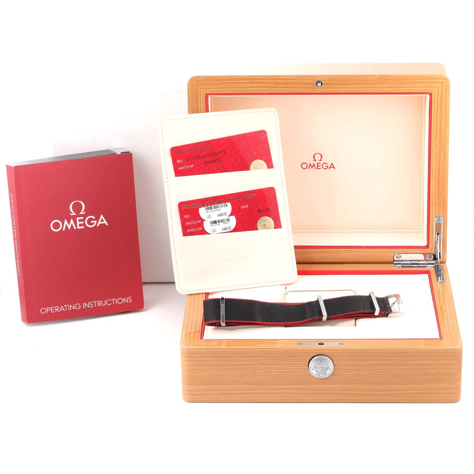 The image shows the accessories for an Omega Seamaster 212.30.41.20.01.003 Men's Stainless Steel Black Dial 212.30.41.20.01.003 Men's Stainless Steel Black Dial model, including a box, manual, cards, and an extra strap.
